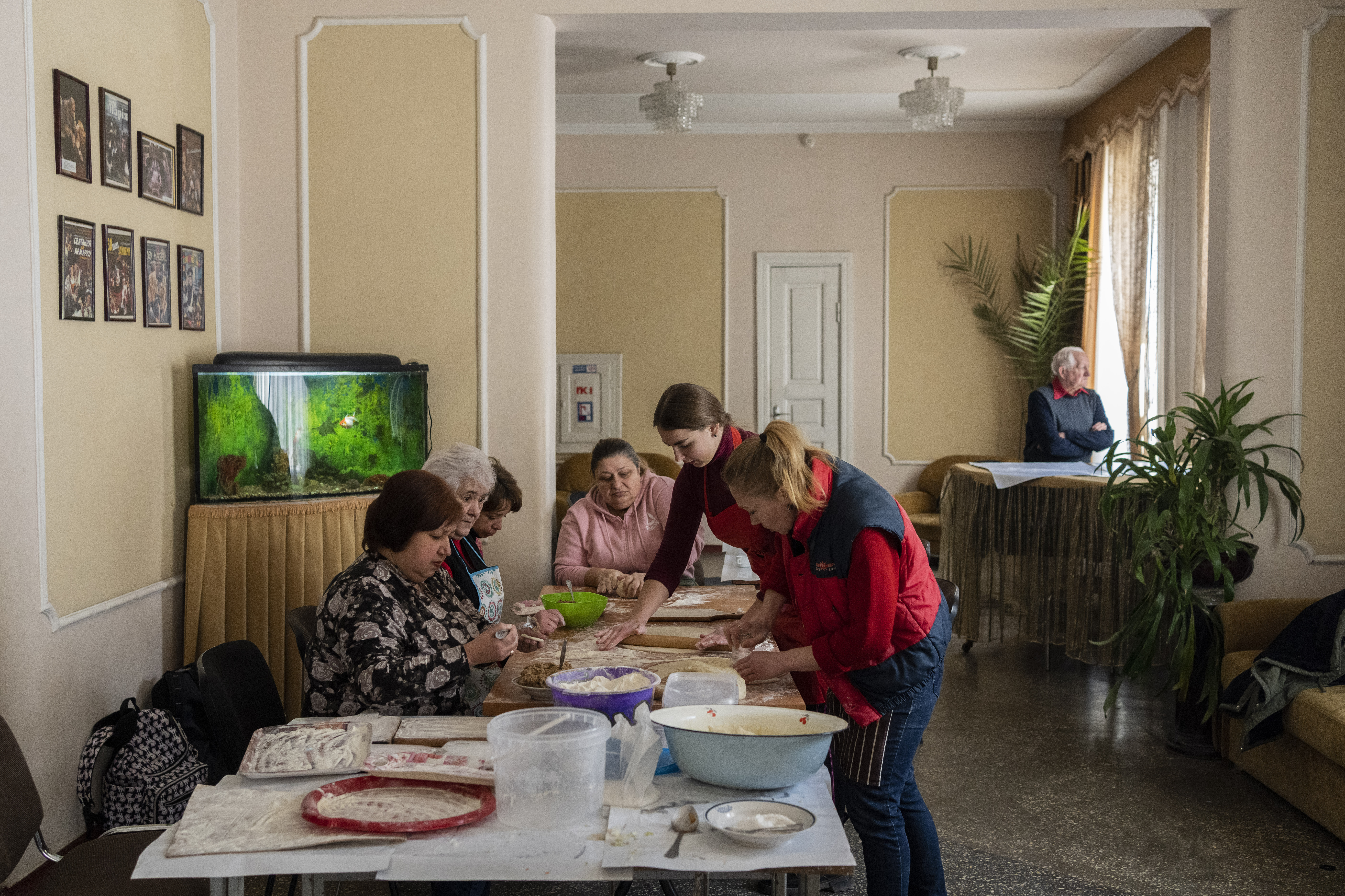 Volunteers prepare varenyky, stuffed dumplings, inside a theatre in the city of Drohobych