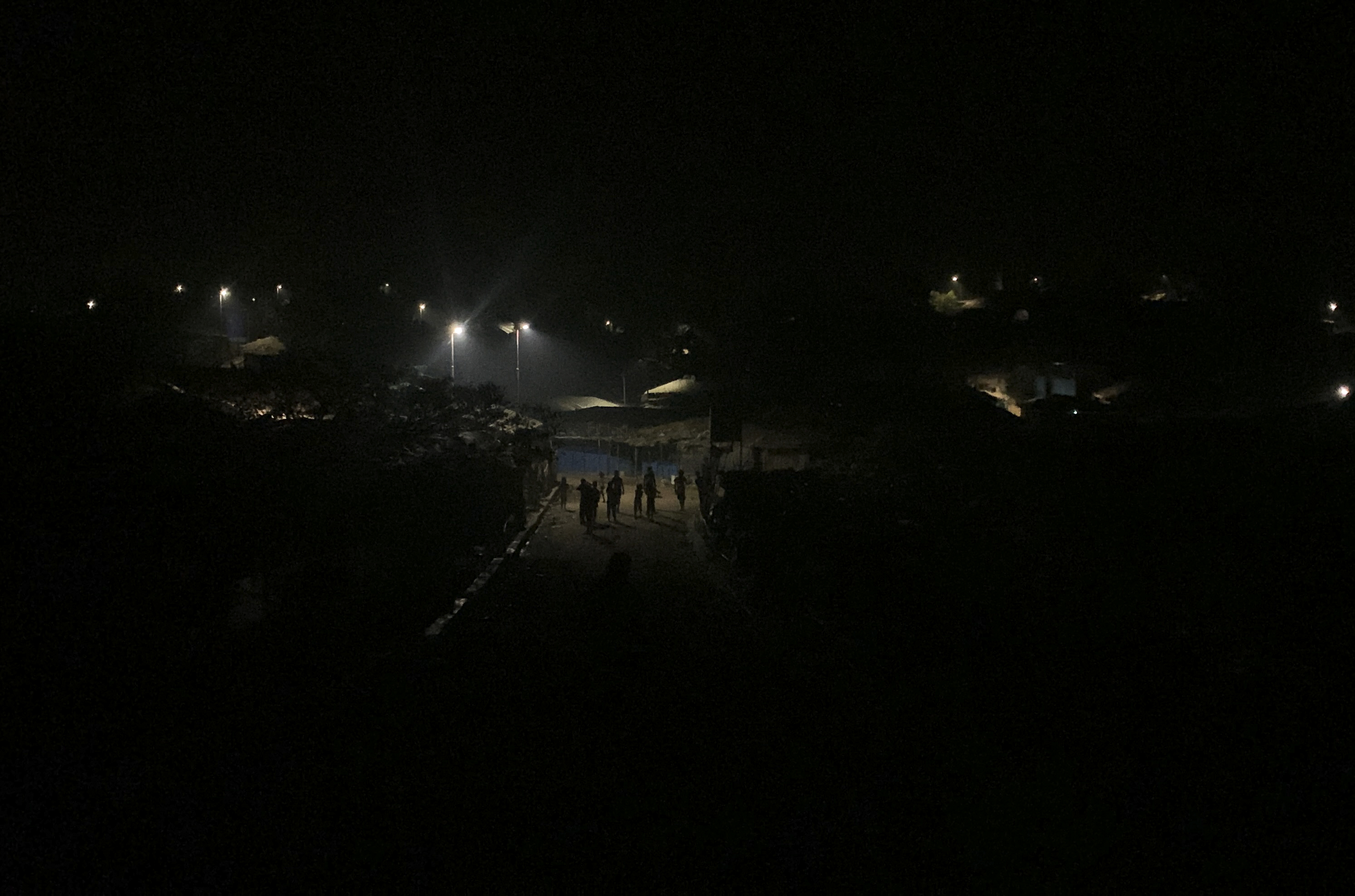 Rohingya refugees walk at the Kutupalong Rohingya camp