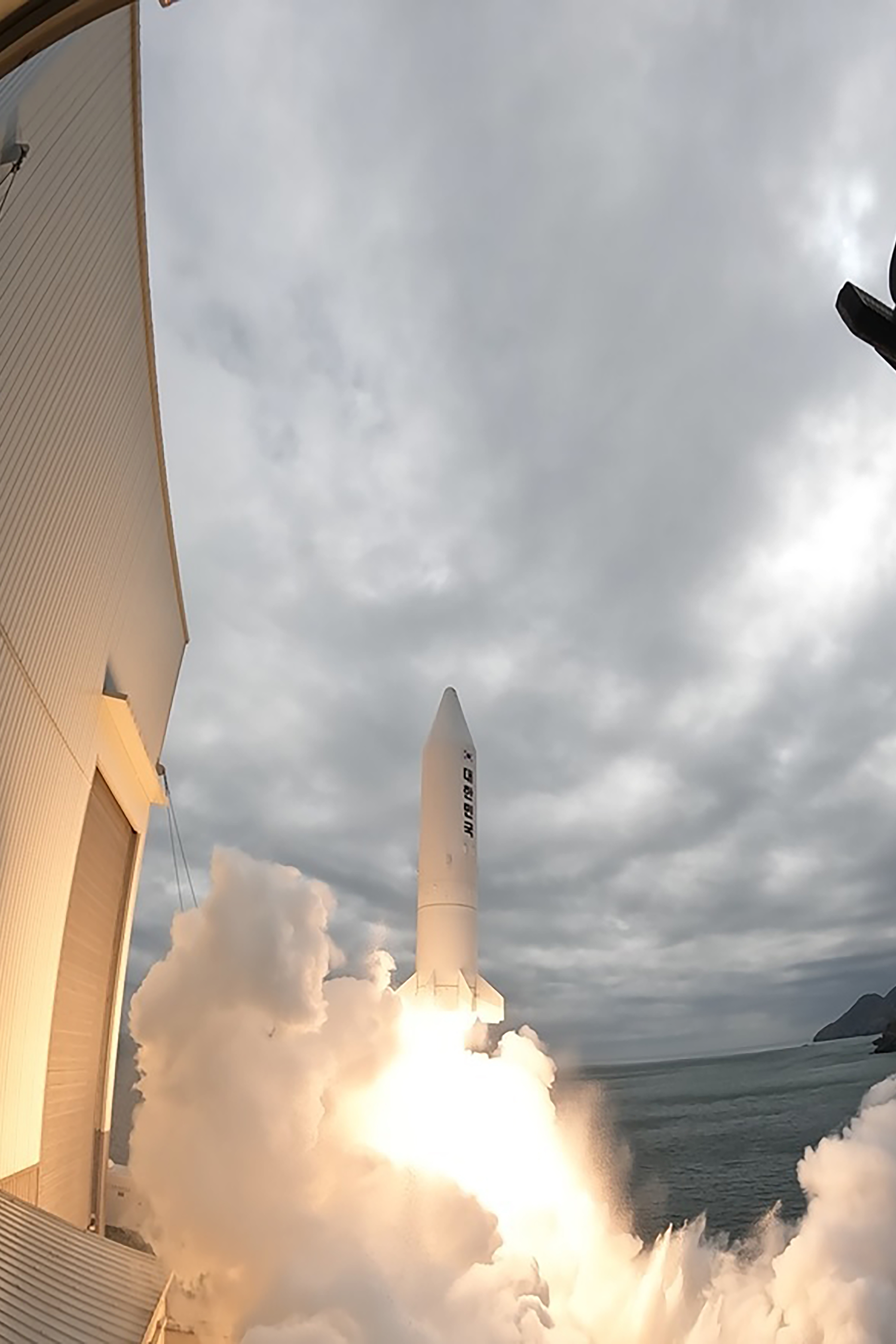 South Korea's solid-fuel rocket is launched in a cloud of white smoke