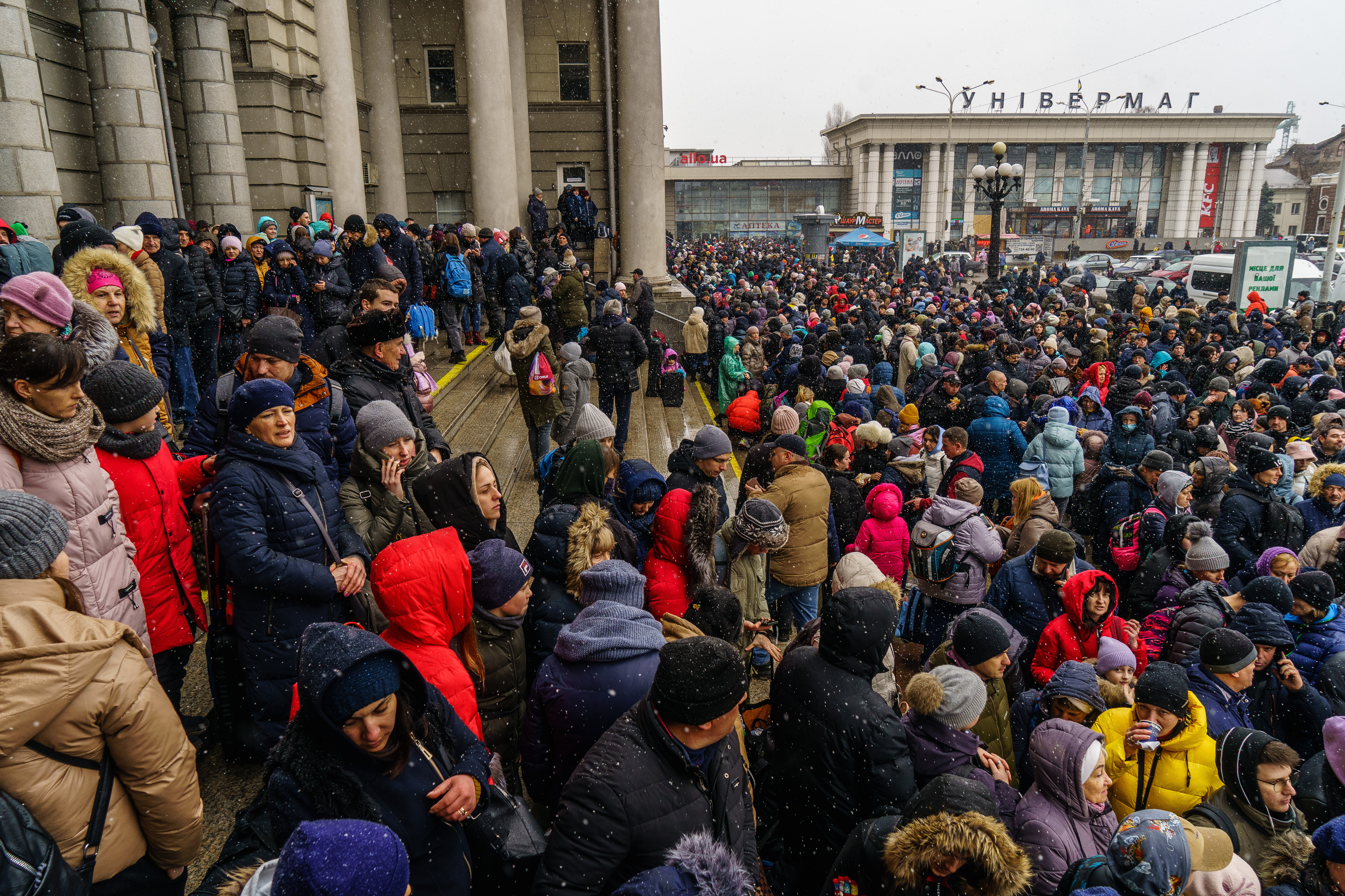 People try to get an evacuation train at Dnipro train station
