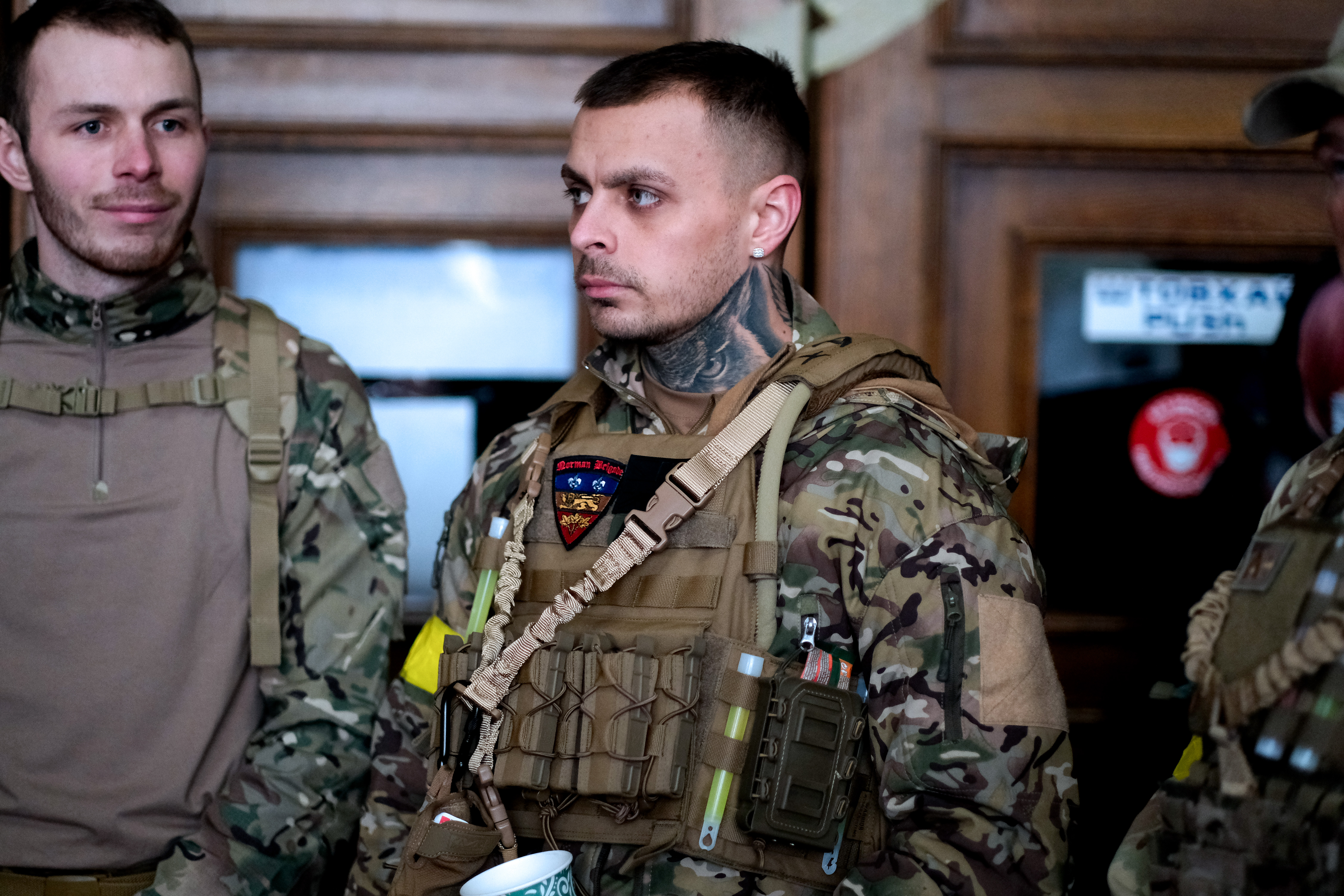 A photo of three ex-British Servicemen.