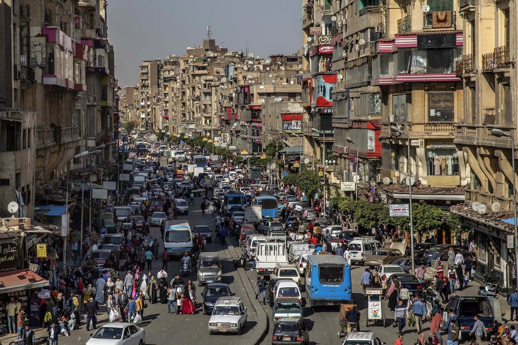 People crowd a street in Cairo, Egypt