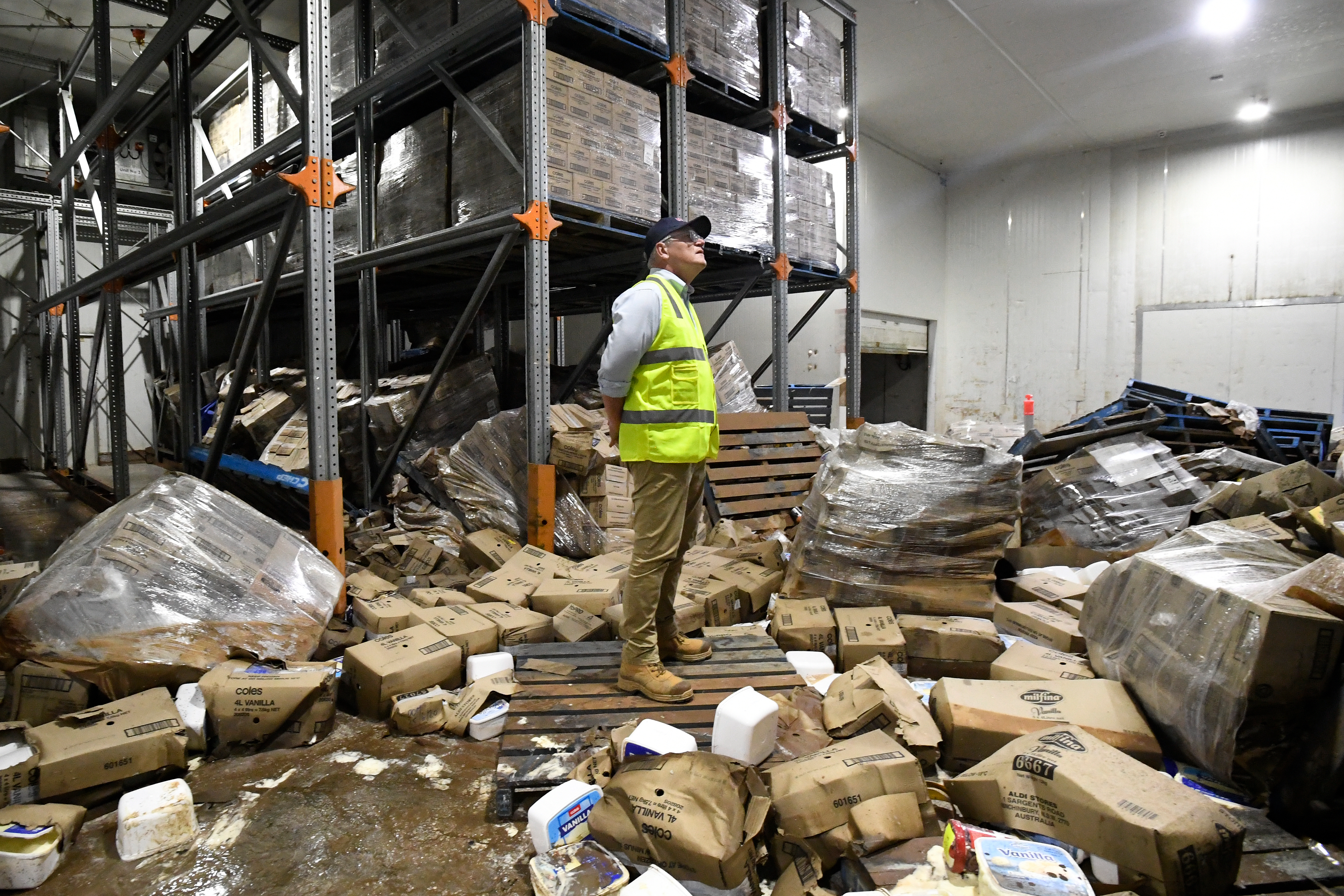Prime Minister Scott Morrison inspects flood damage at the Norco Ice Cream Factory in Lismore