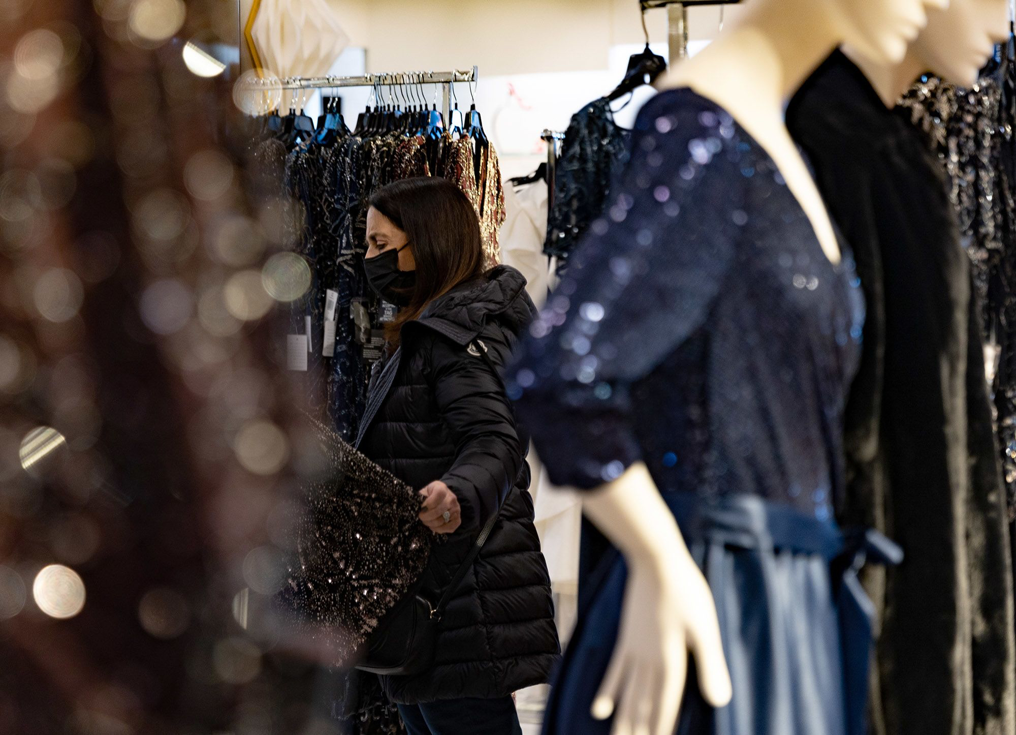 A shopper views gowns for sale at a store inside a mall in King of Prussia, Pennsylvania