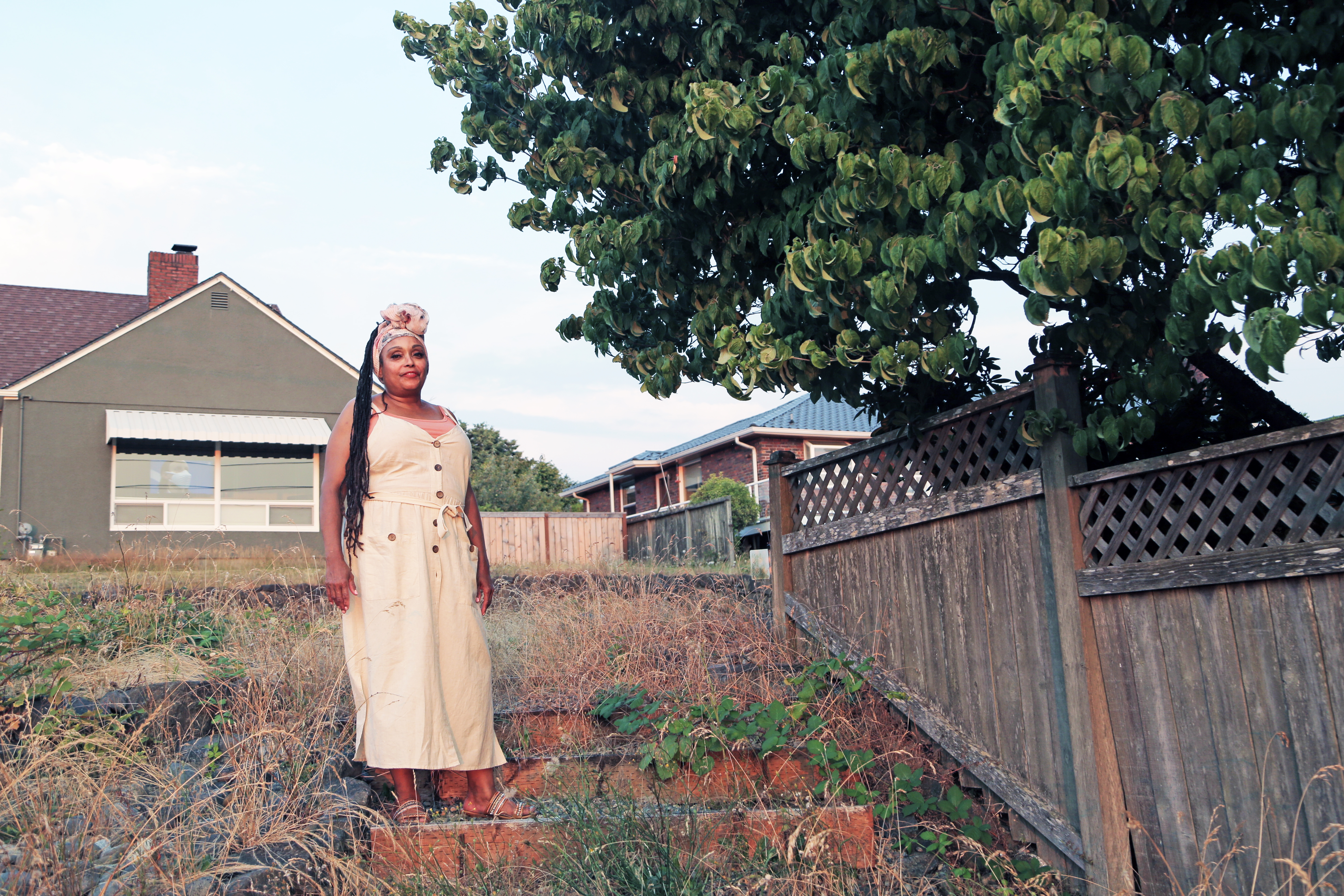 Marcia Carter stands near her family's home