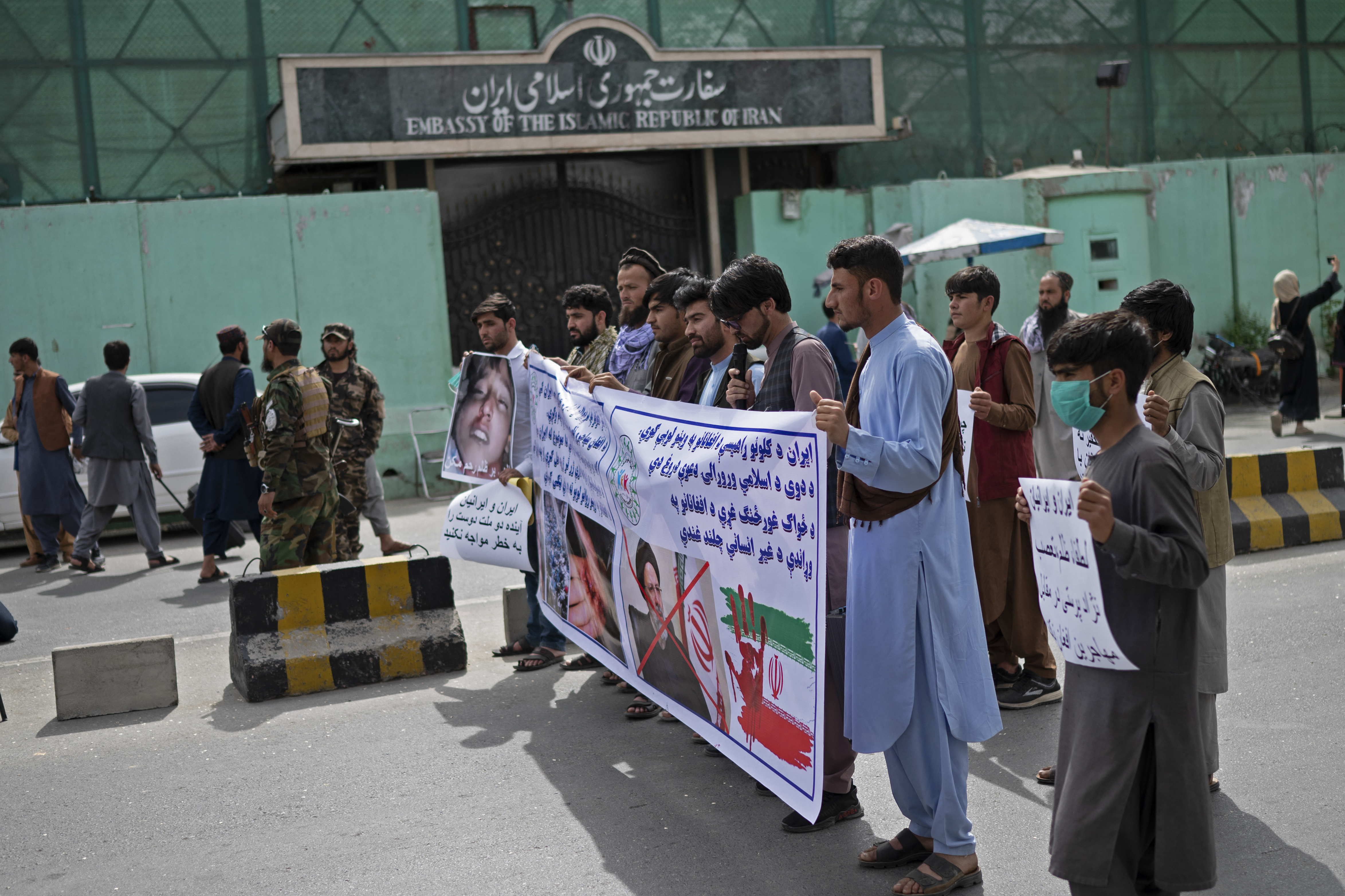 Afghan protestors take part in a protest against the alleged published reports of harassment of Afghan refugees in Iran, in front of the Iranian embassy in Kabul