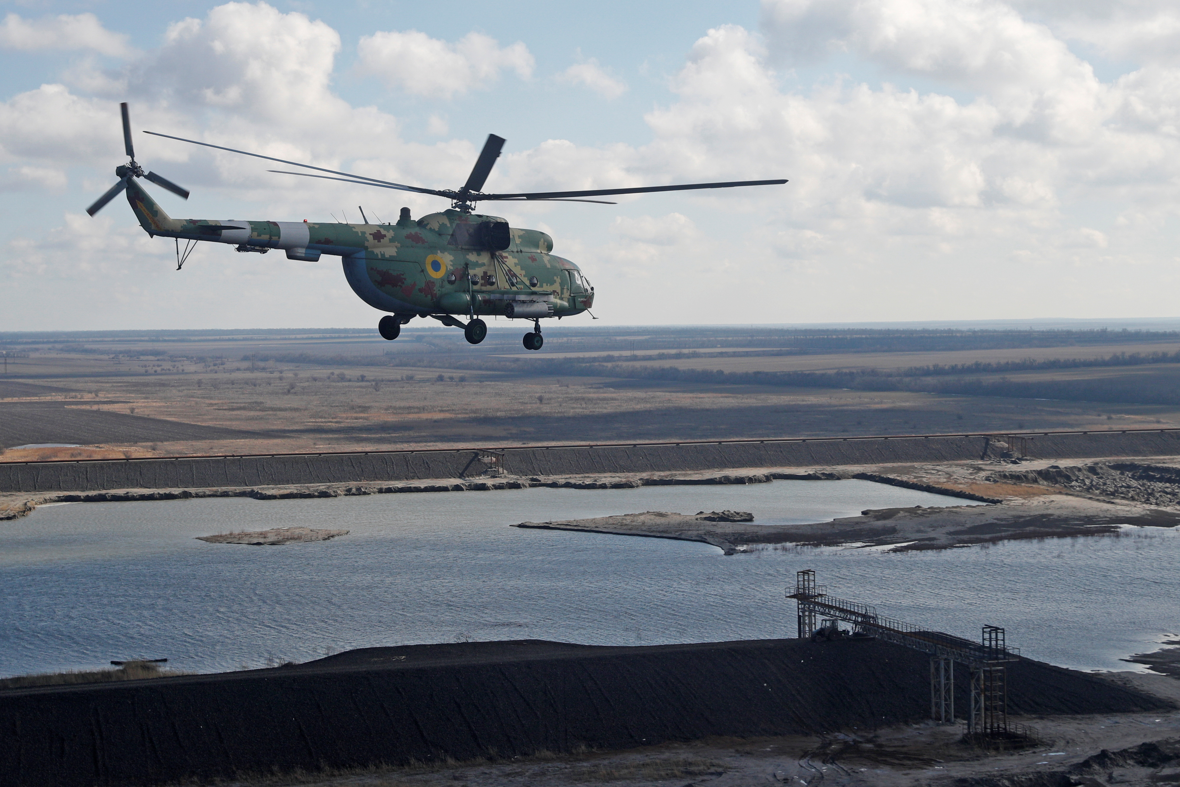 A Mi-8 helicopter of the Ukrainian Armed Forces is seen flying over the country's eastern Donetsk region