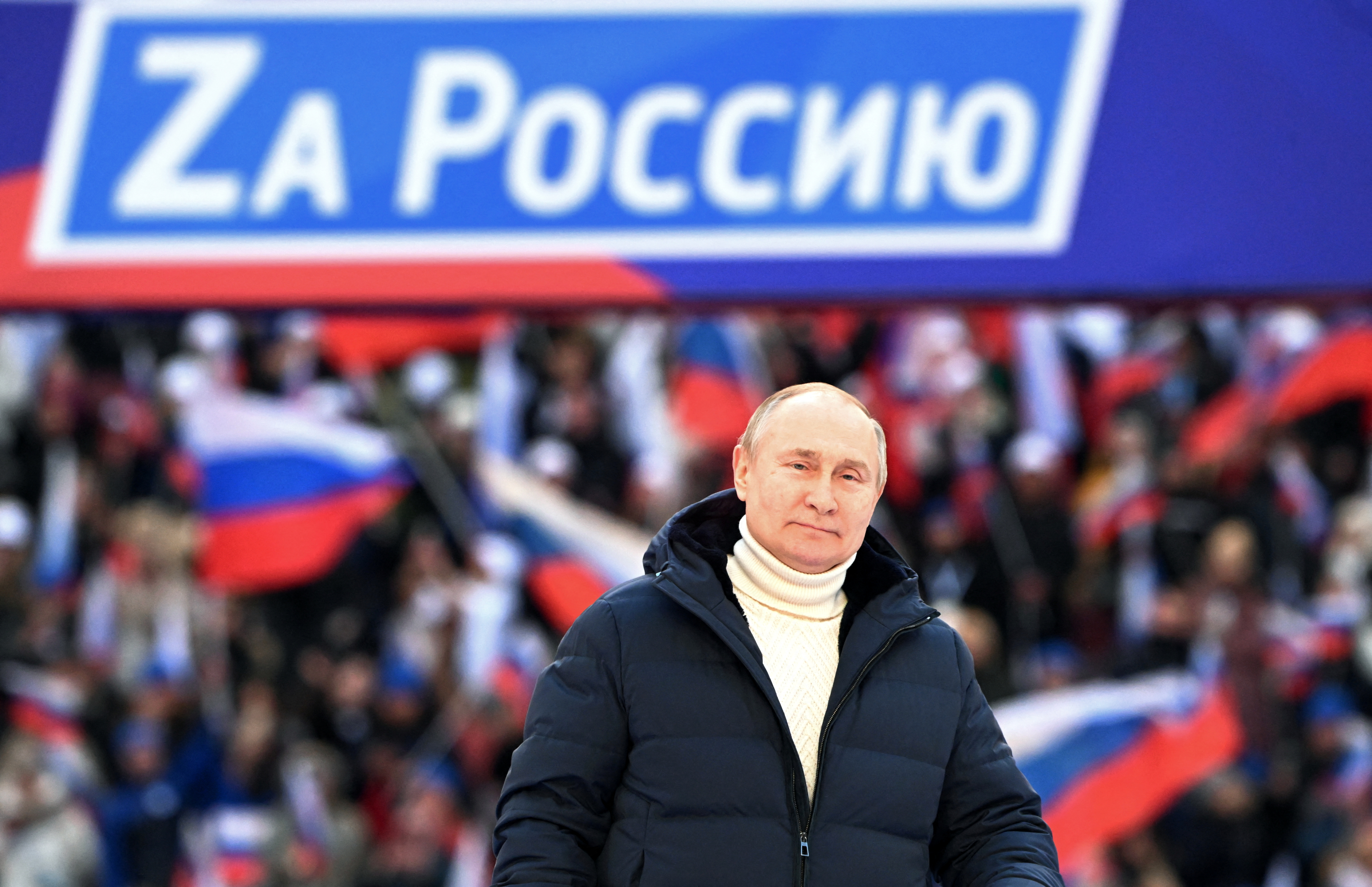 Russian President Vladimir Putin attends a concert marking the eighth anniversary of Russia's annexation of Crimea in Moscow in March 2022