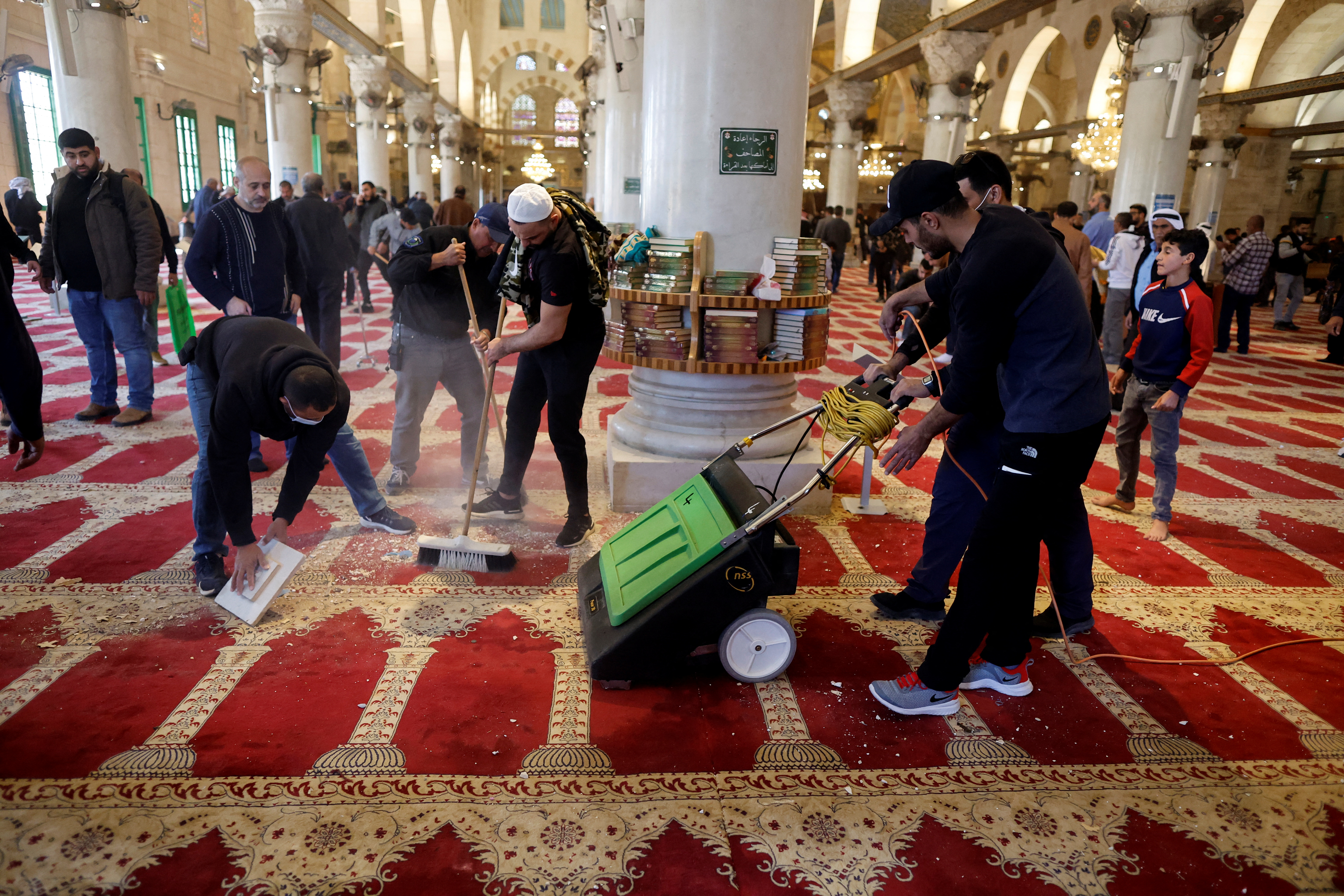 Palestinians clean the al-Aqsa mosque