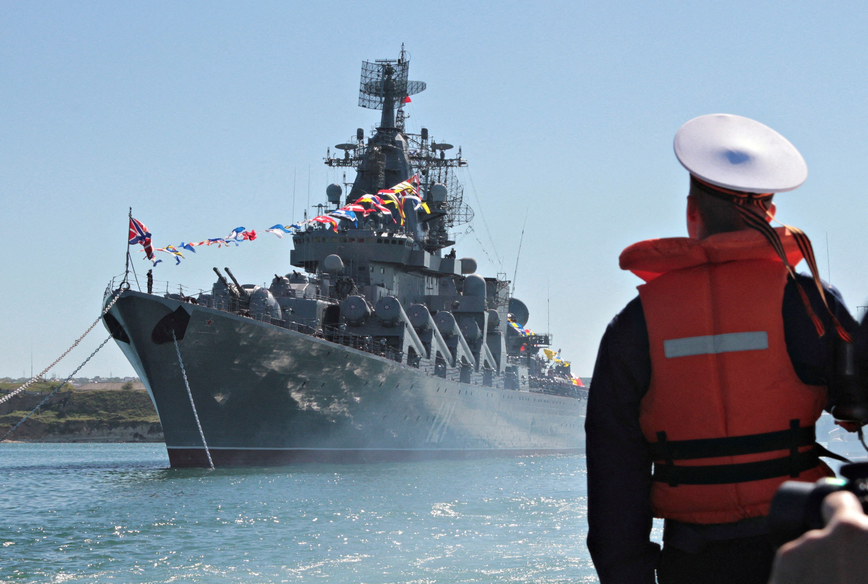 A sailor looks at the Moskva when it was moored in Sevastopol
