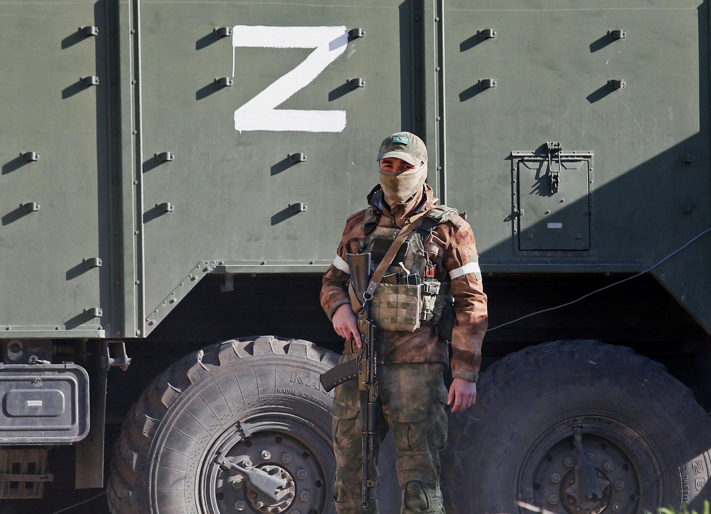 A pro-Russian soldier on guard in Mariupol