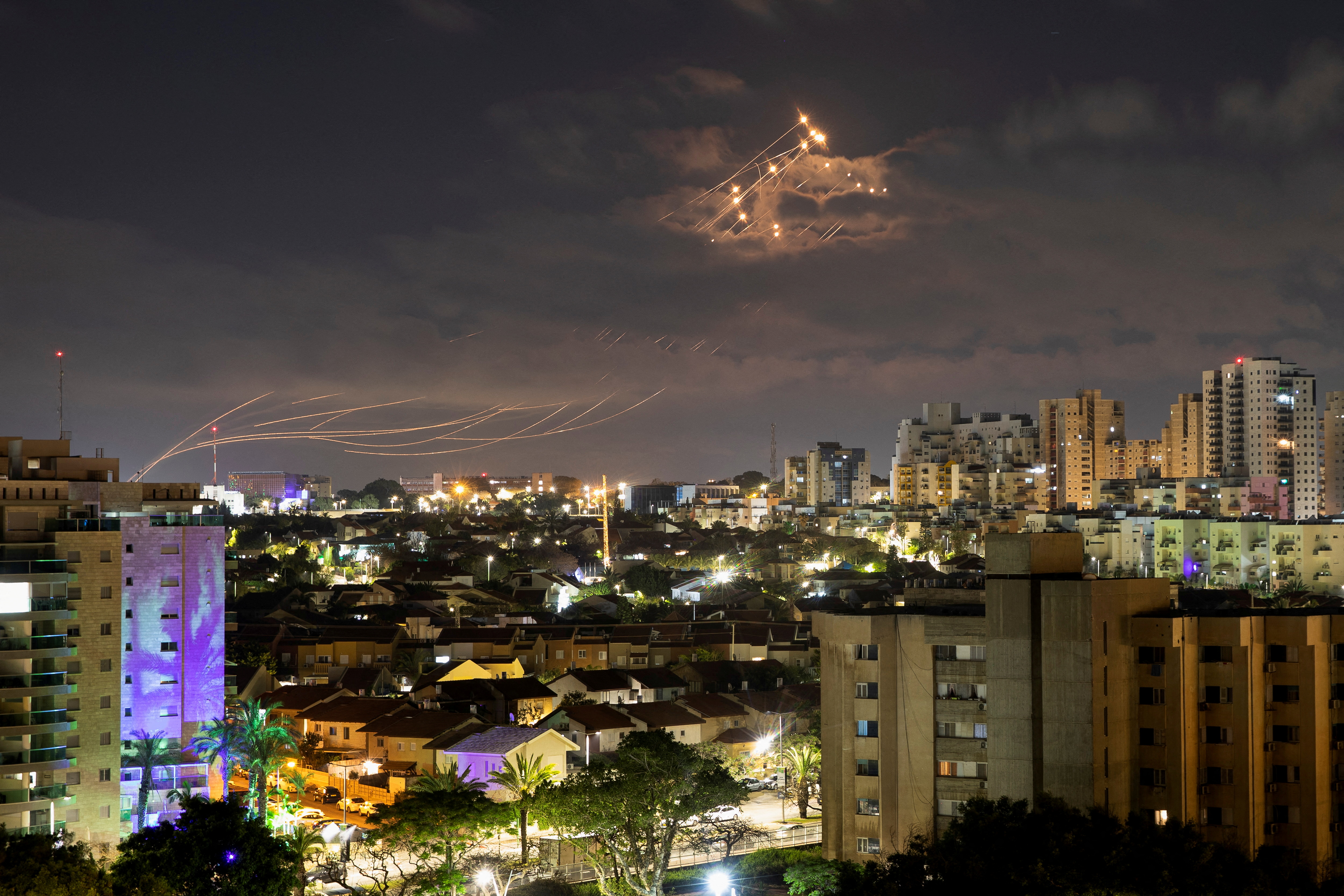 Streaks of light are seen as Israel's Iron Dome anti-missile system intercepts rockets launched from the Gaza Strip.