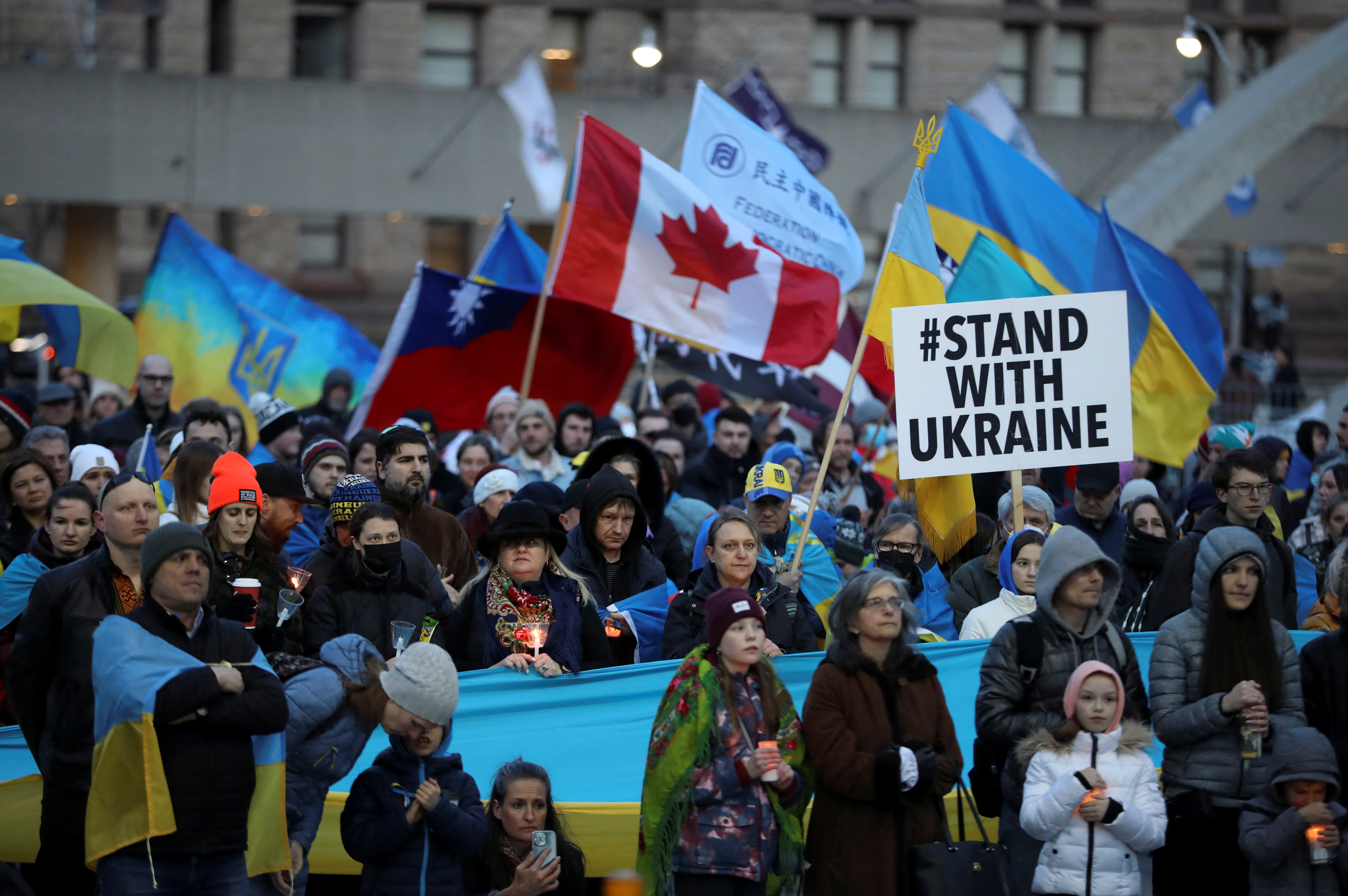 People attend a candlelight vigil for Ukraine on the Orthodox Holy Saturday, at Nathan Phillips Square in Toronto, Ontario, Canada