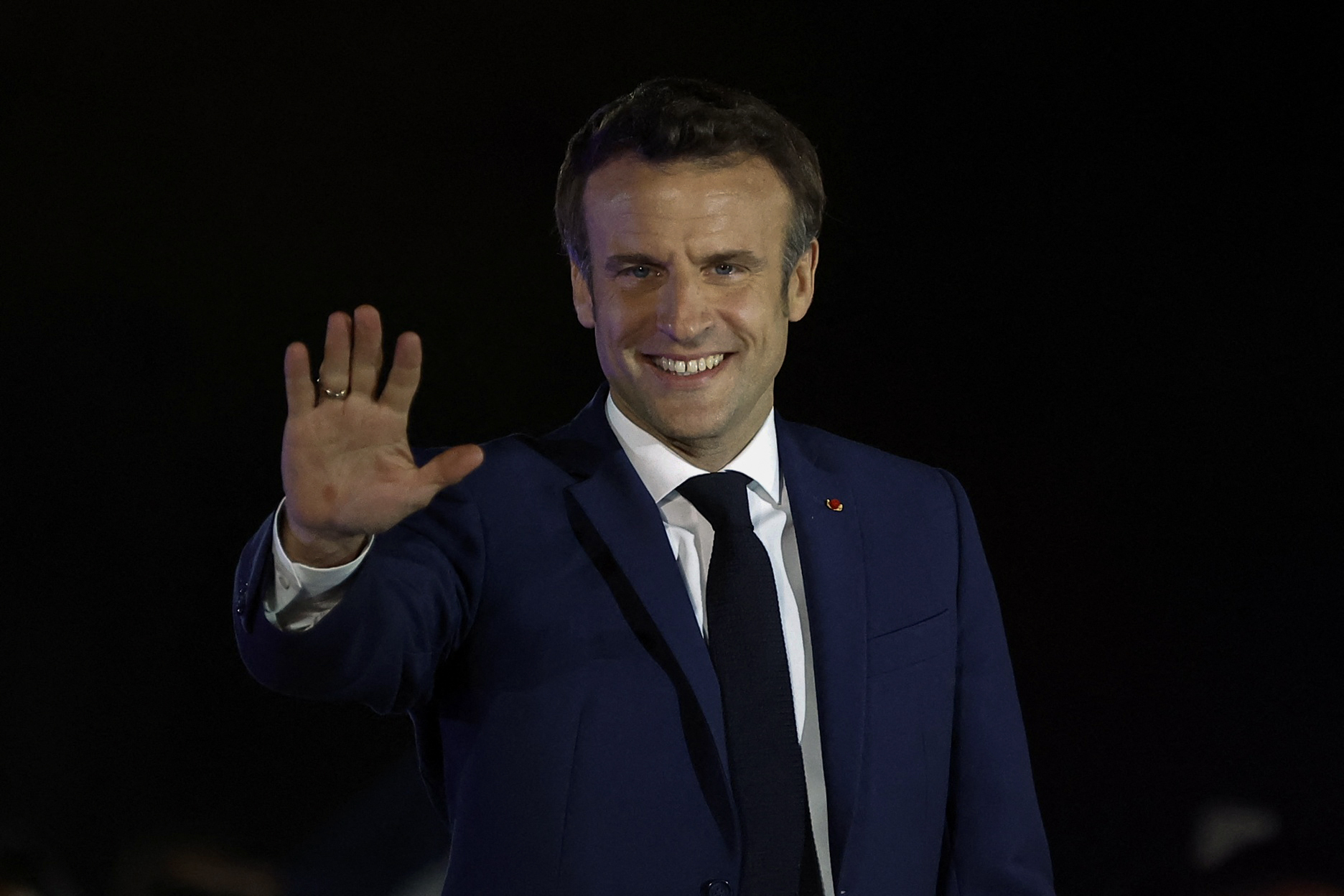 French President Emmanuel Macron arrives to deliver a speech after being re-elected as president