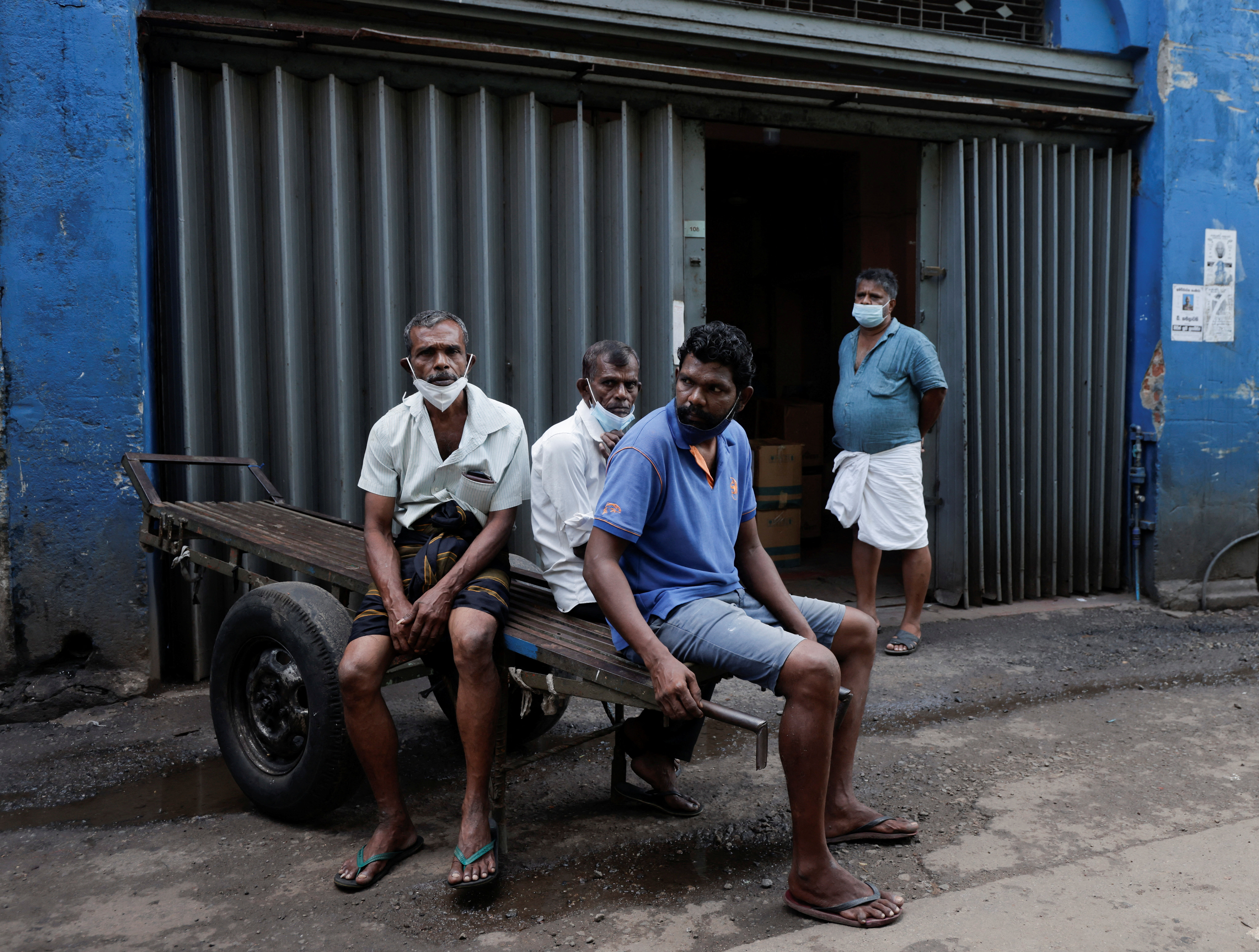 Workers are seen at a wholesale market during a nationwide strike