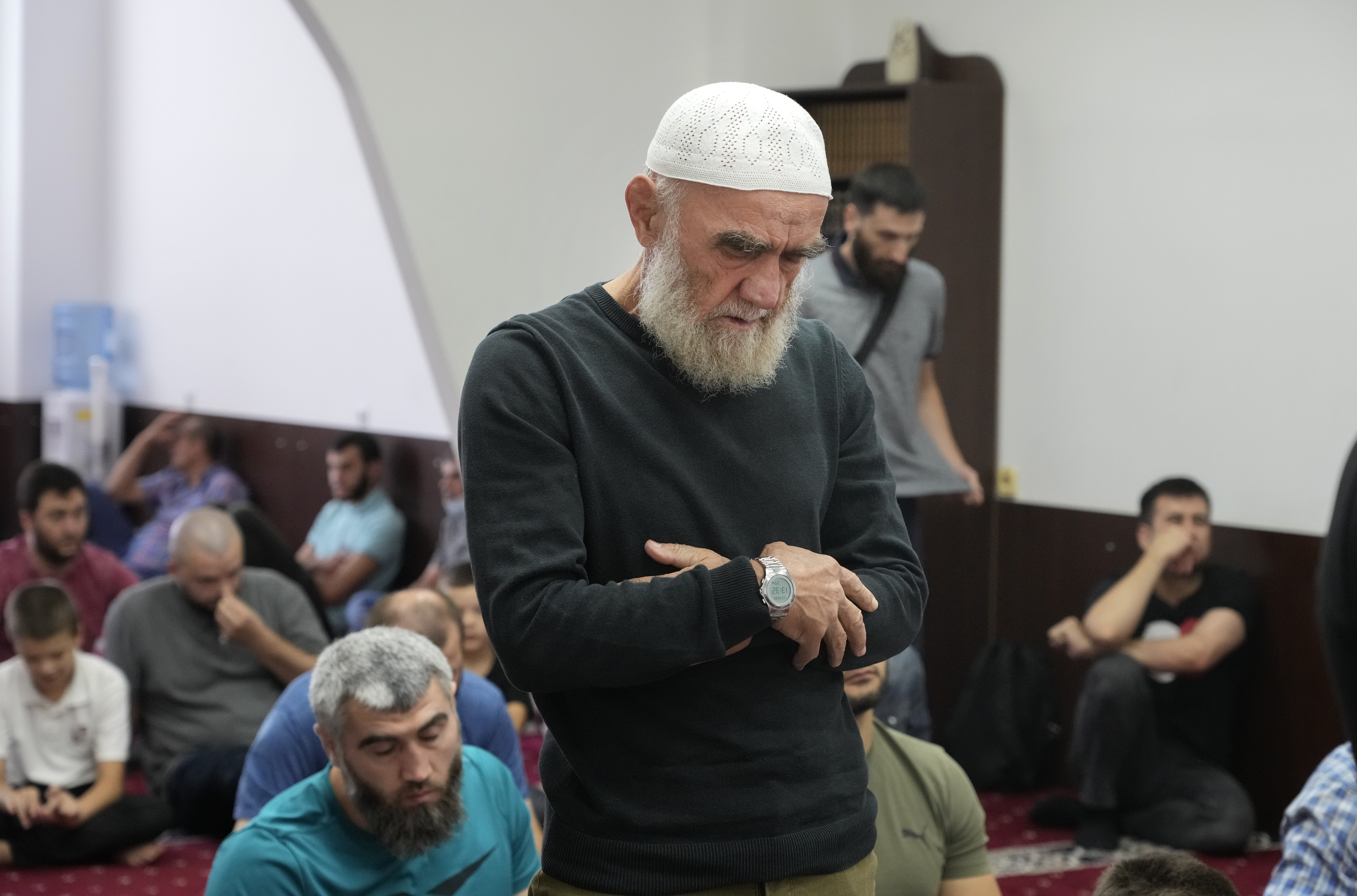 Crimean Tatars pray ina mosque in Kyiv, Ukraine, Friday, Aug. 13, 2021.