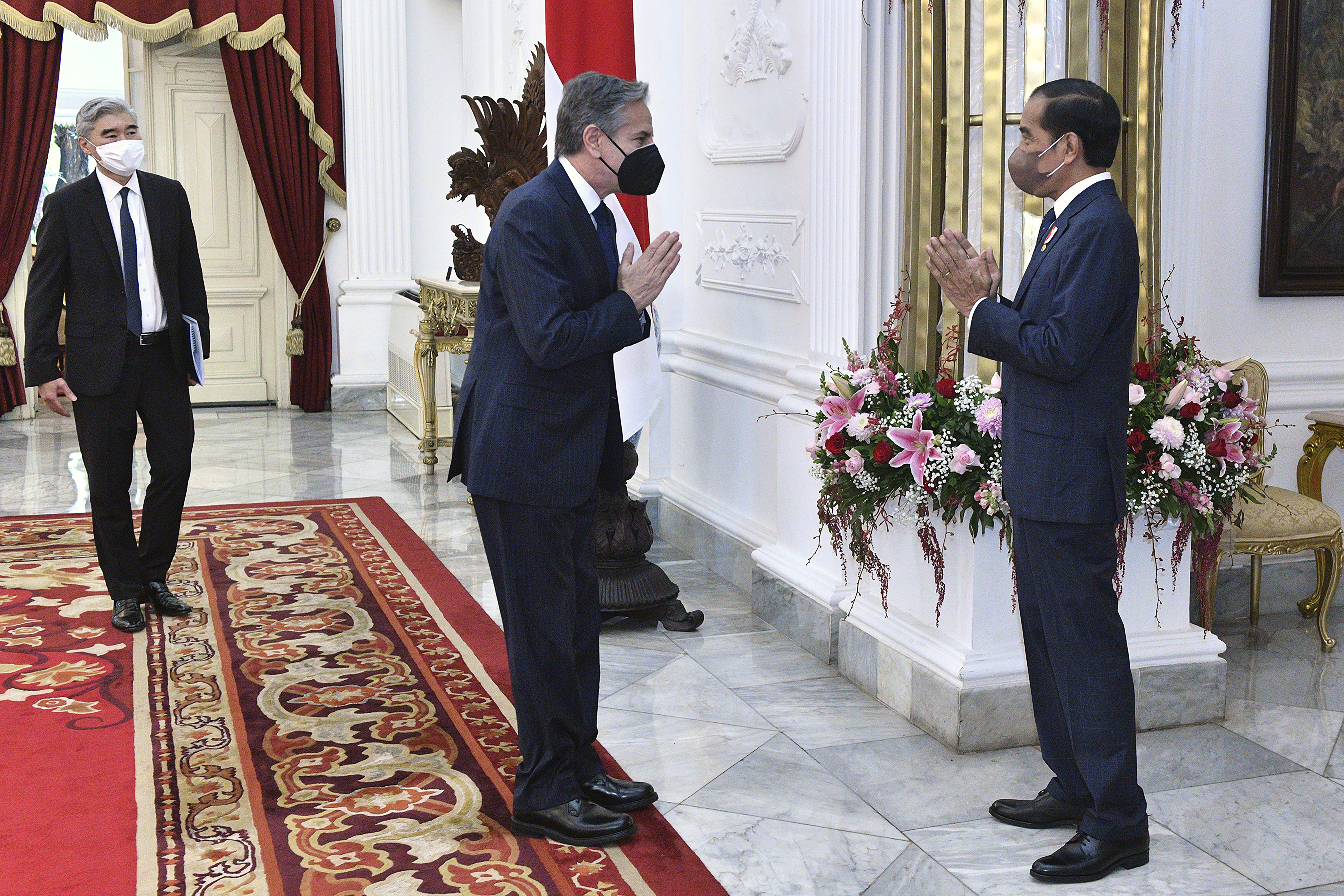 US Secretary of State Antony Blinken greets Indonesian president Joko Widodo in the presidential palace in Jakarta
