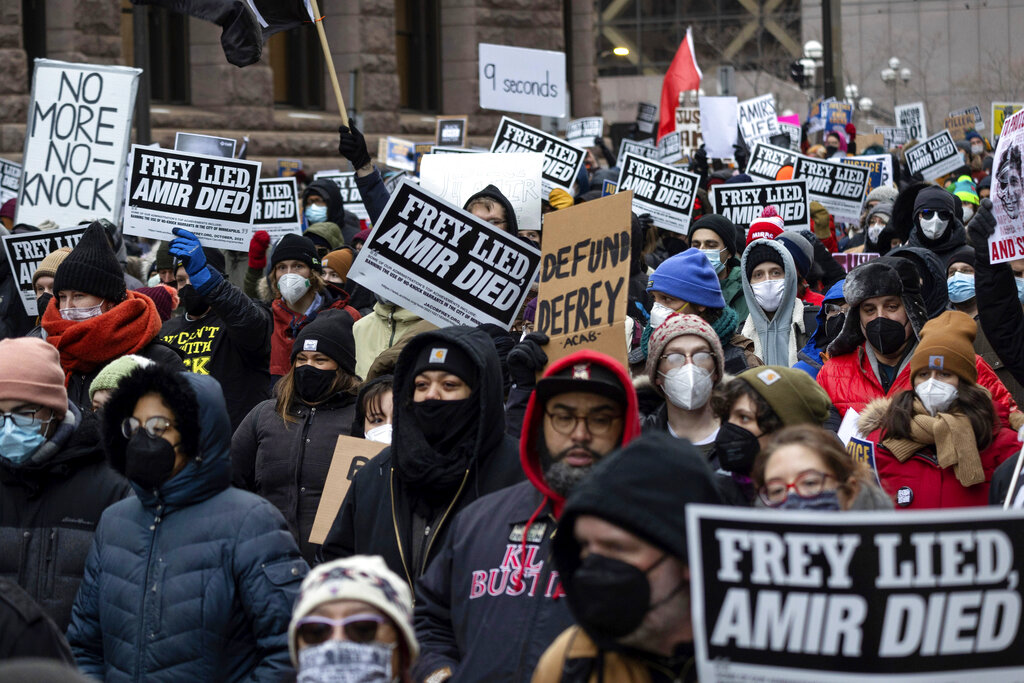 People march at a rally for Amir Locke on Saturday, Feb. 5, 2022, in Minneapolis.