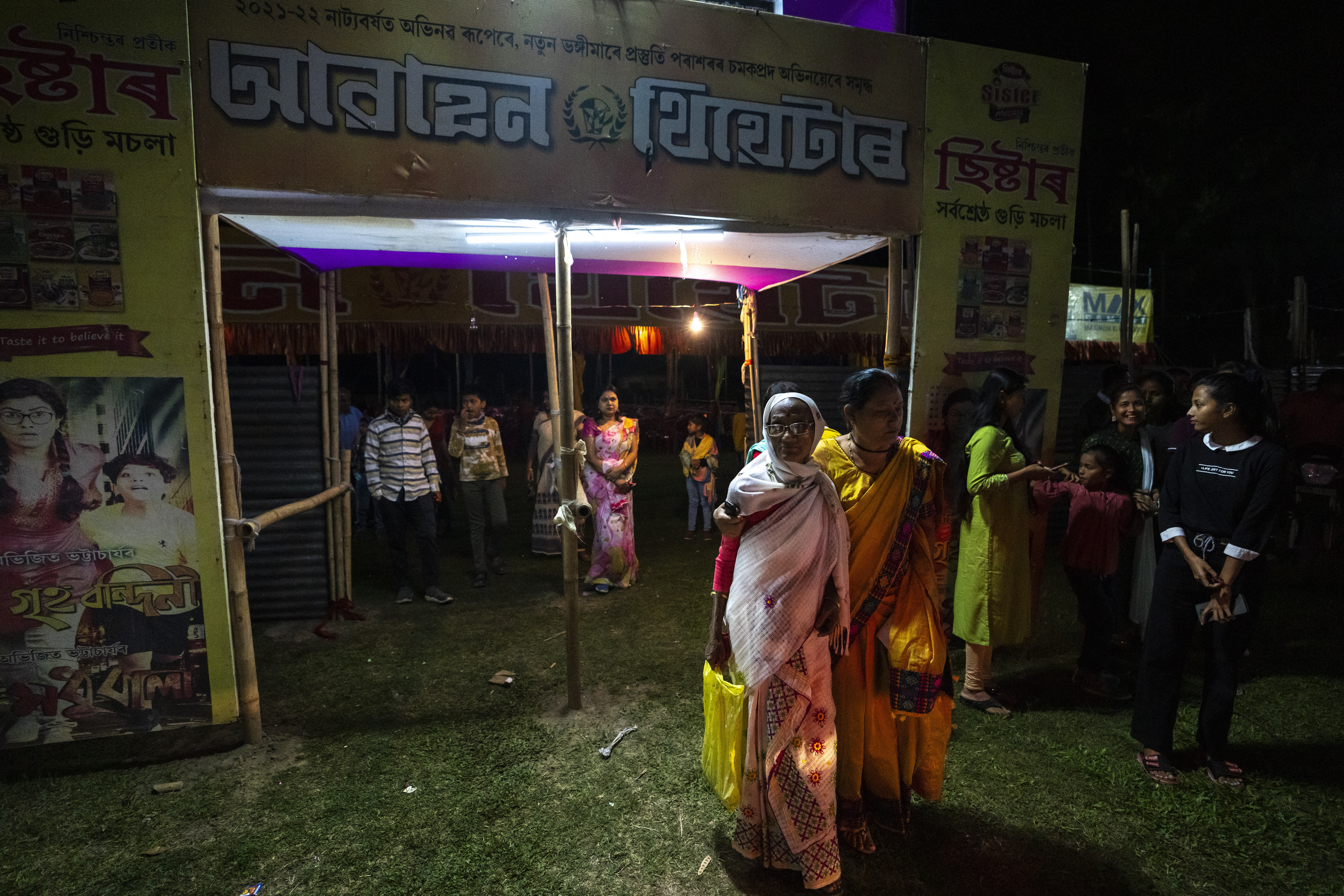 People leave after a performance by Awahan traveling theater