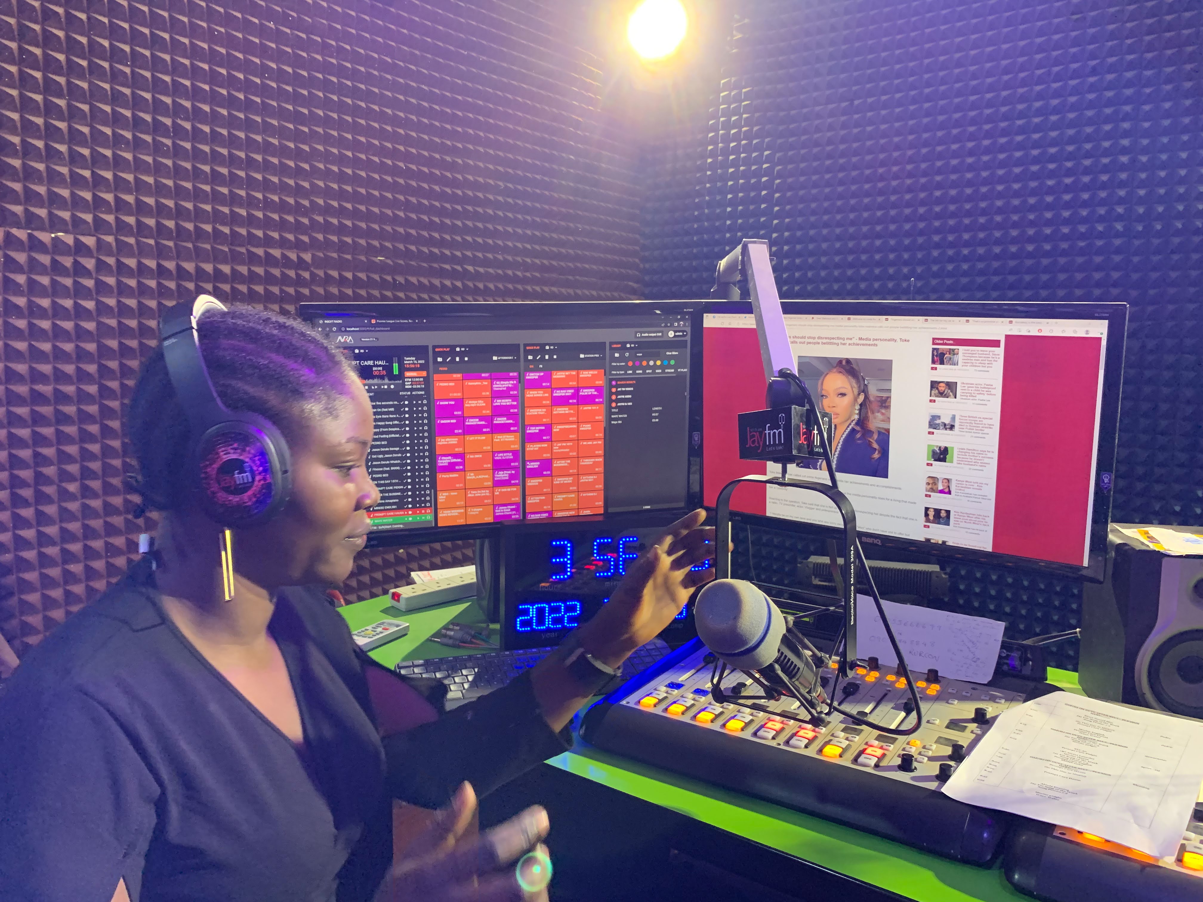 A woman hosts a radio show