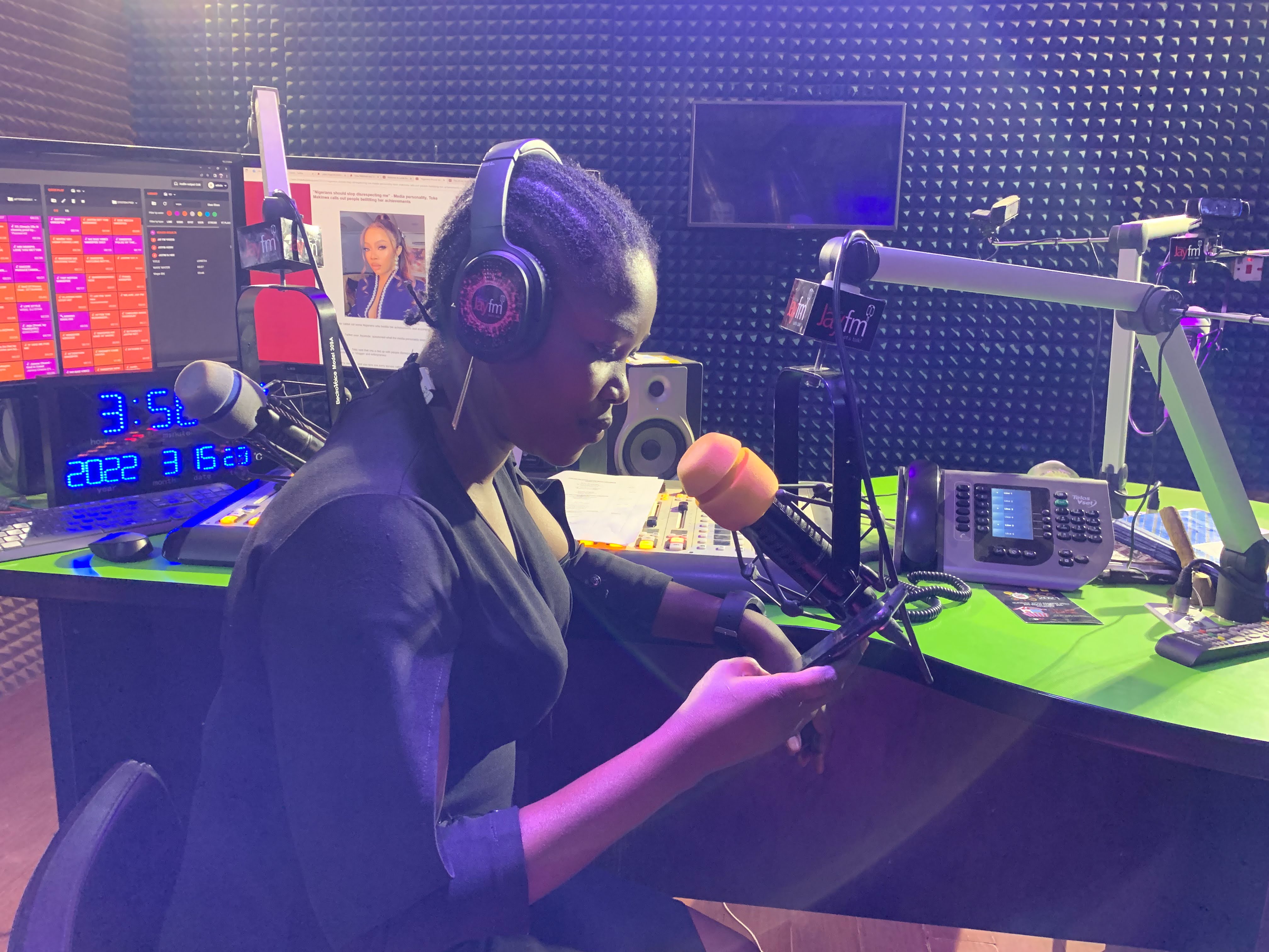 A woman hosts a radio show