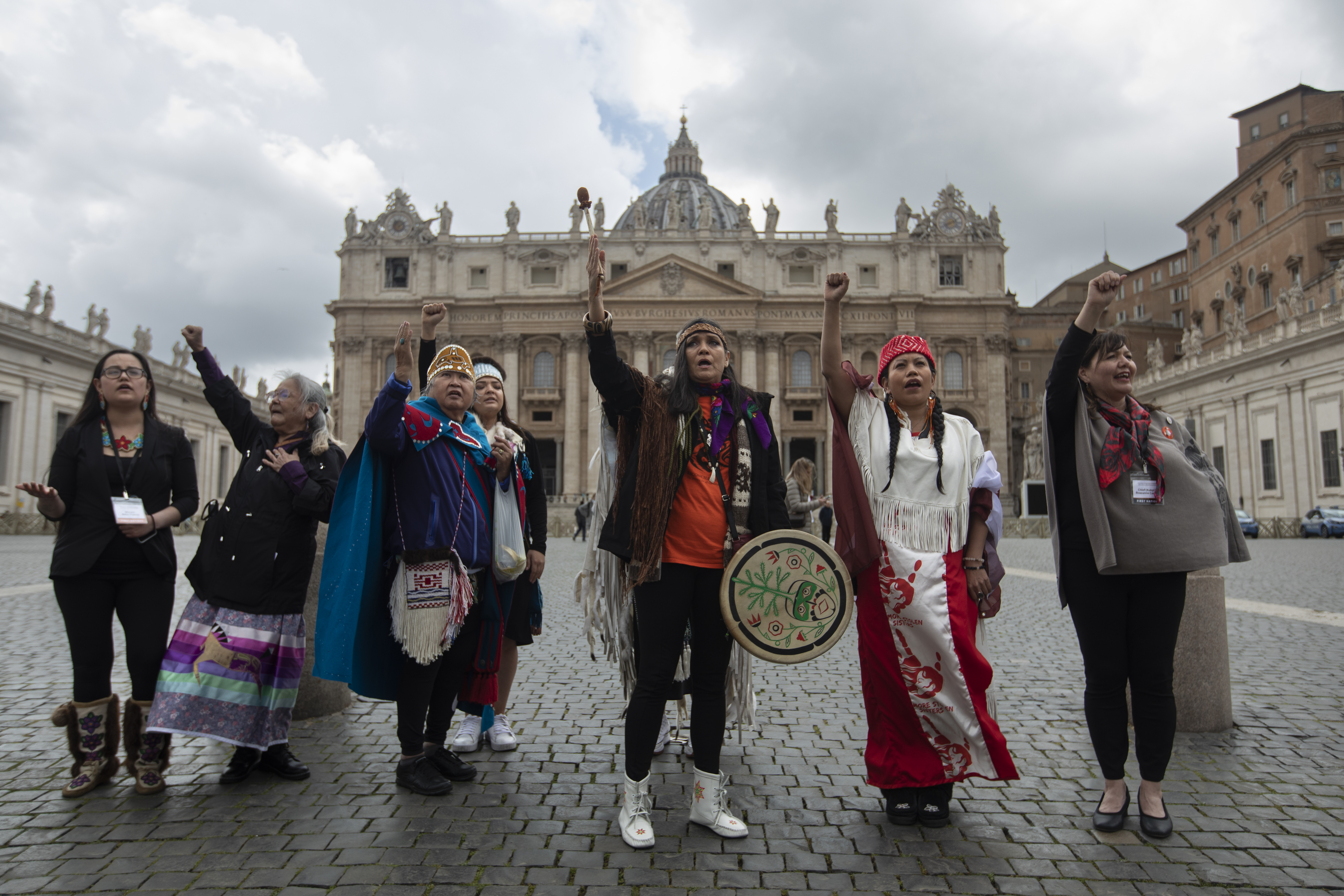 A photo of seven women standing next to each other.