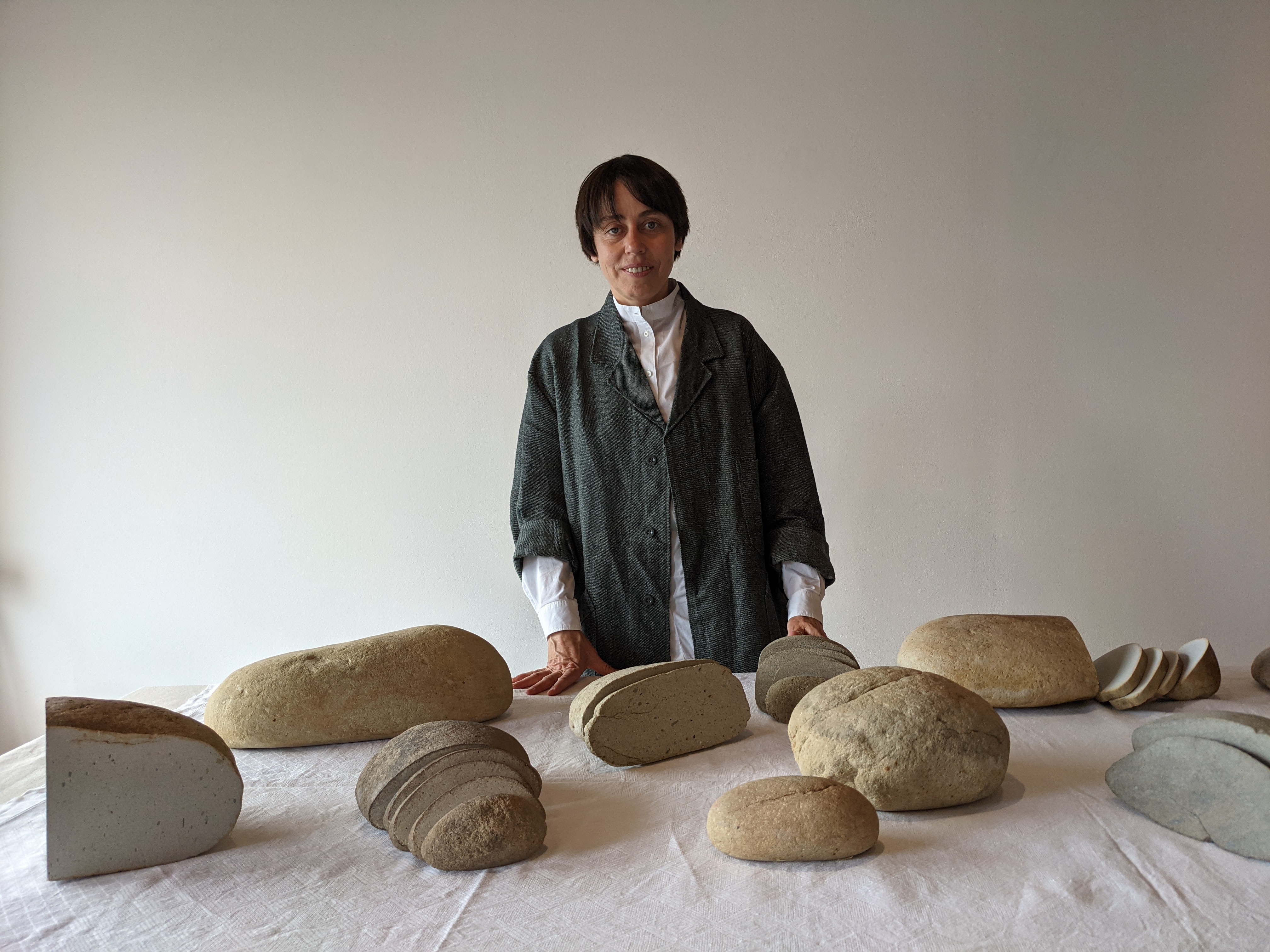Ukranian artist Zhanna Kadyrova's exhibition features stones she took from the village to which she fled after Russia invaded Ukraine in February [Ruairi Casey/Al Jazeera]