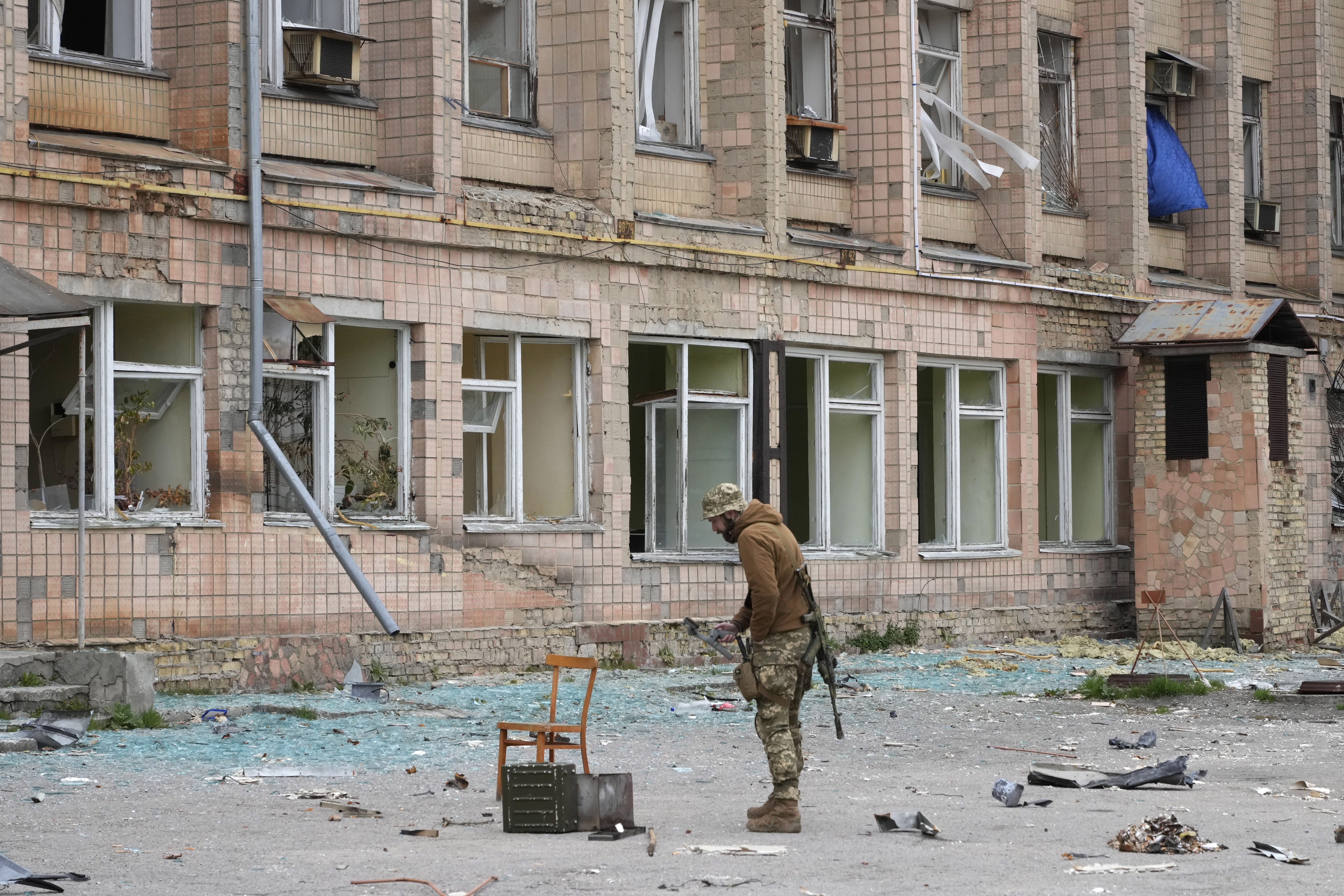 A Ukrainian soldier stands near a state-run nuclear waste department near the Chernobyl nuclear power plant.