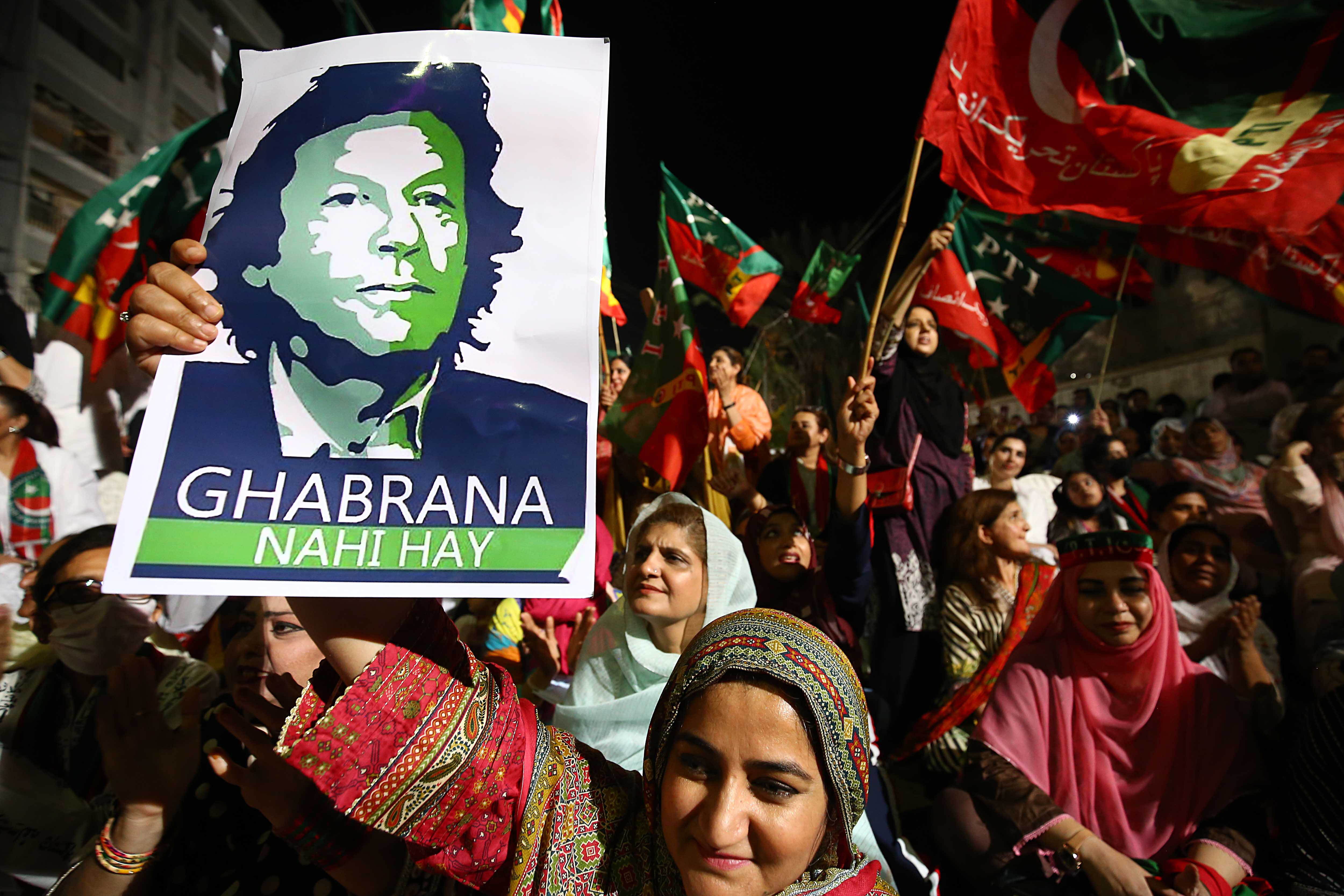 Supporters of Khan's PTI party shout slogans in his favour during a rally in Karachi