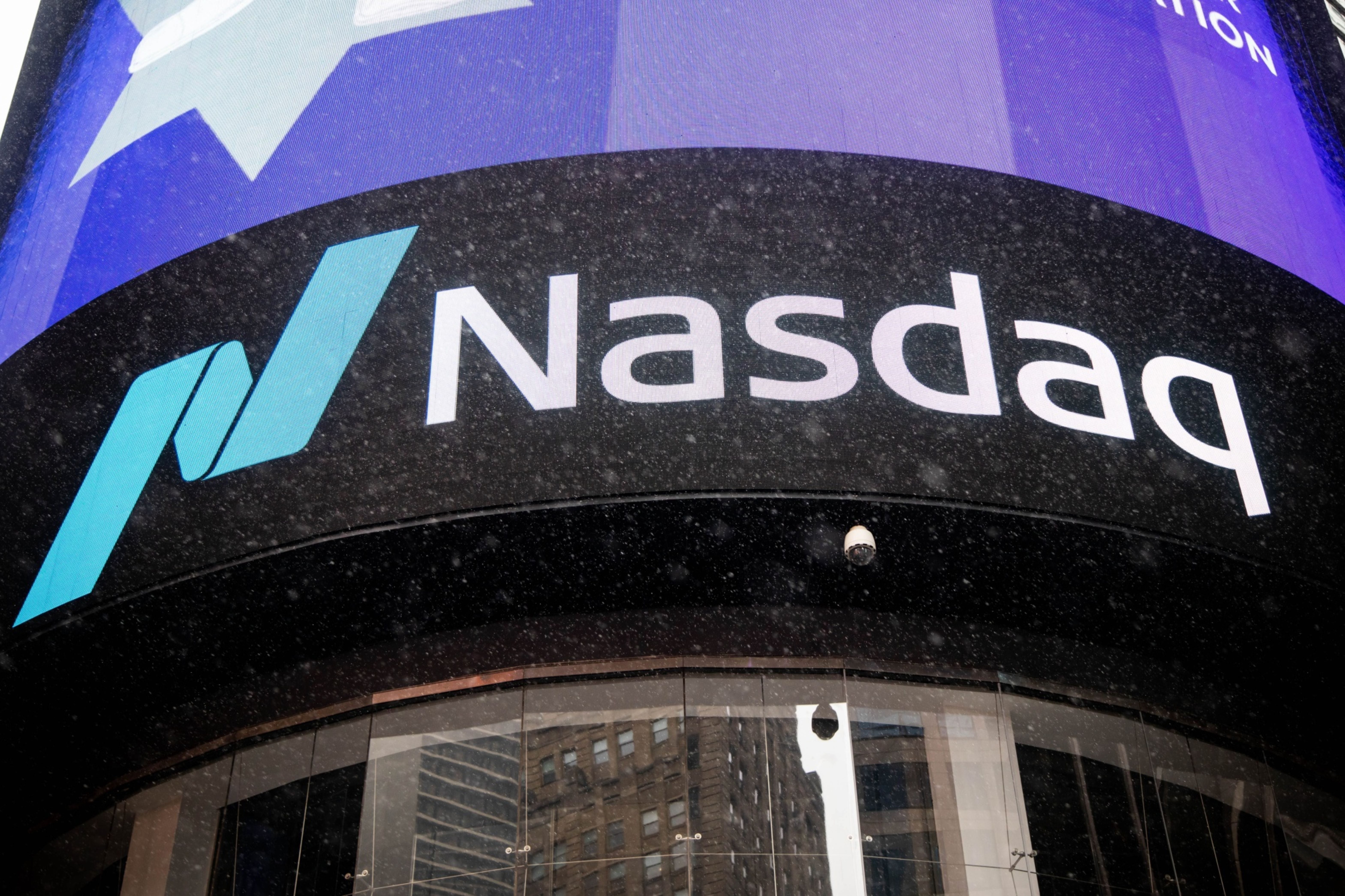 Snow falls in front of the Nasdaq MarketSite in New York, U.S.