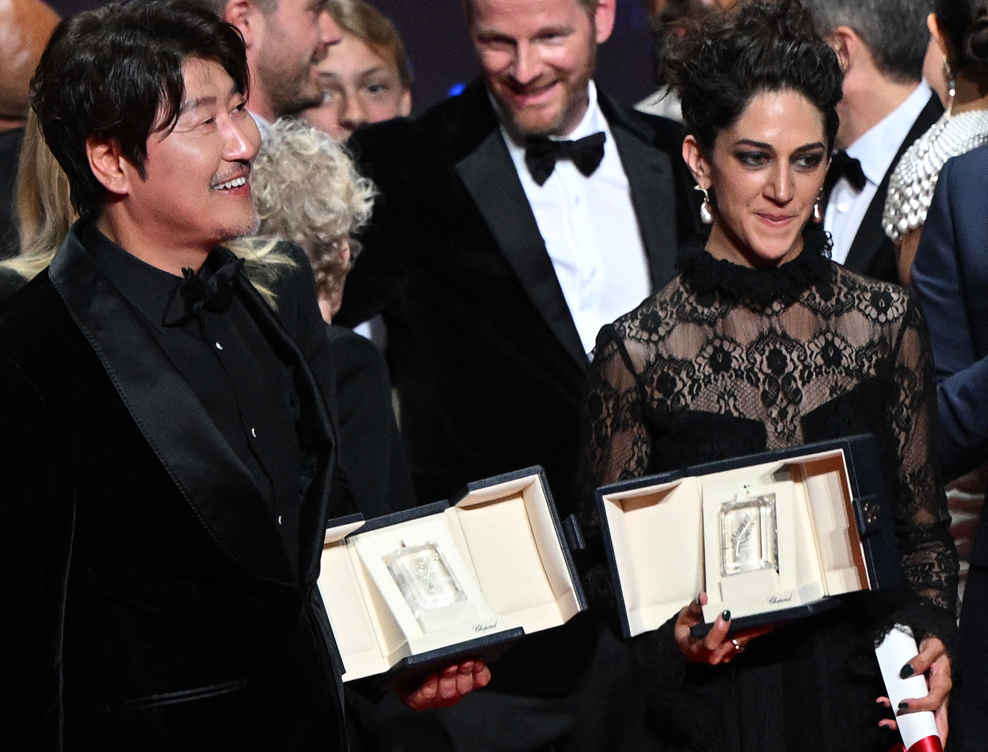 South Korean actor Song Kang-Ho (L) and Iranian actress Zar Amir-Ebrahimi pose with their trophy