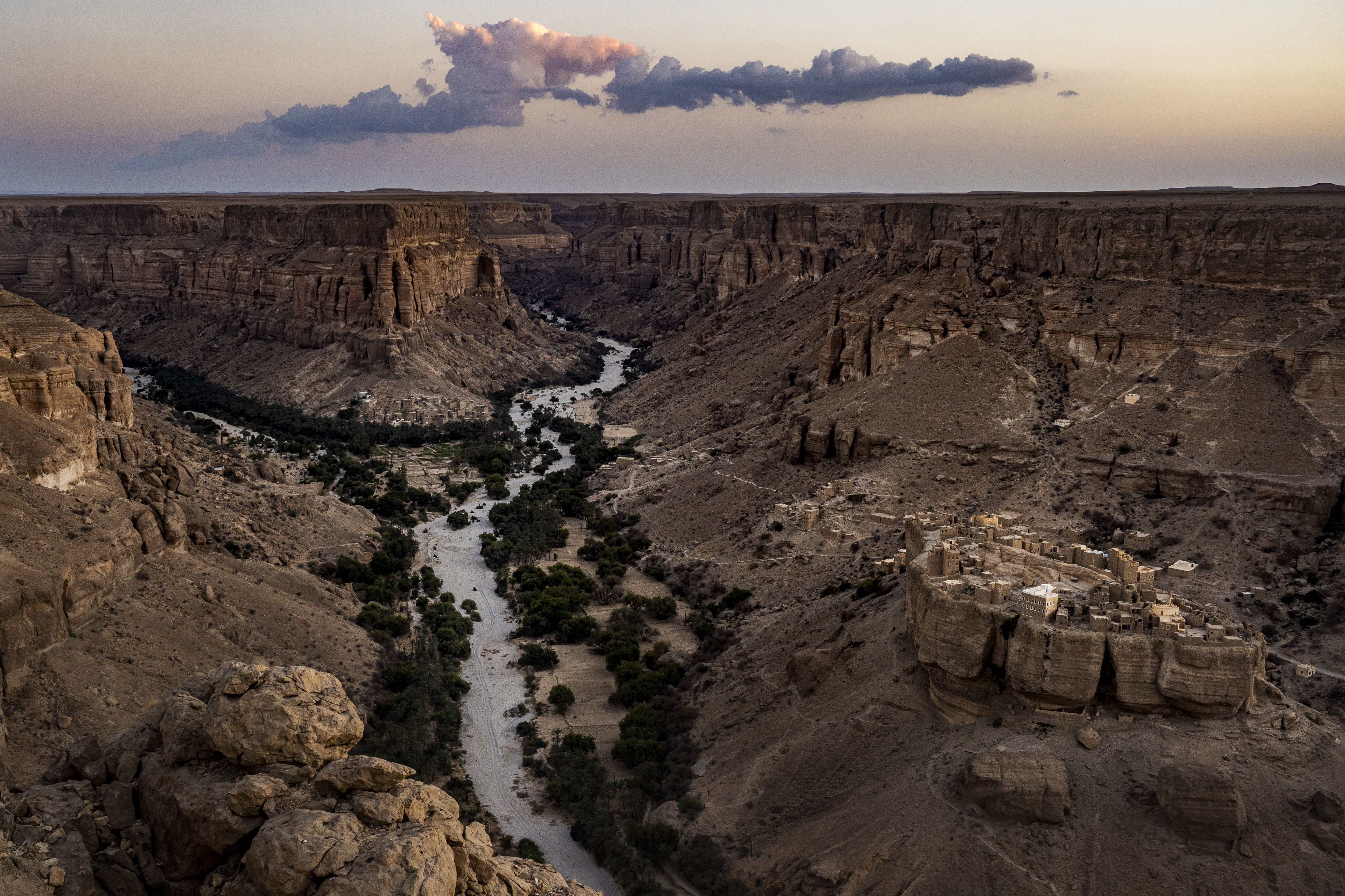 The tiny 500-year-old mud-brick village of Haid Al-Jazil stands perched on a rock in the Dawan Valley in central Yemen