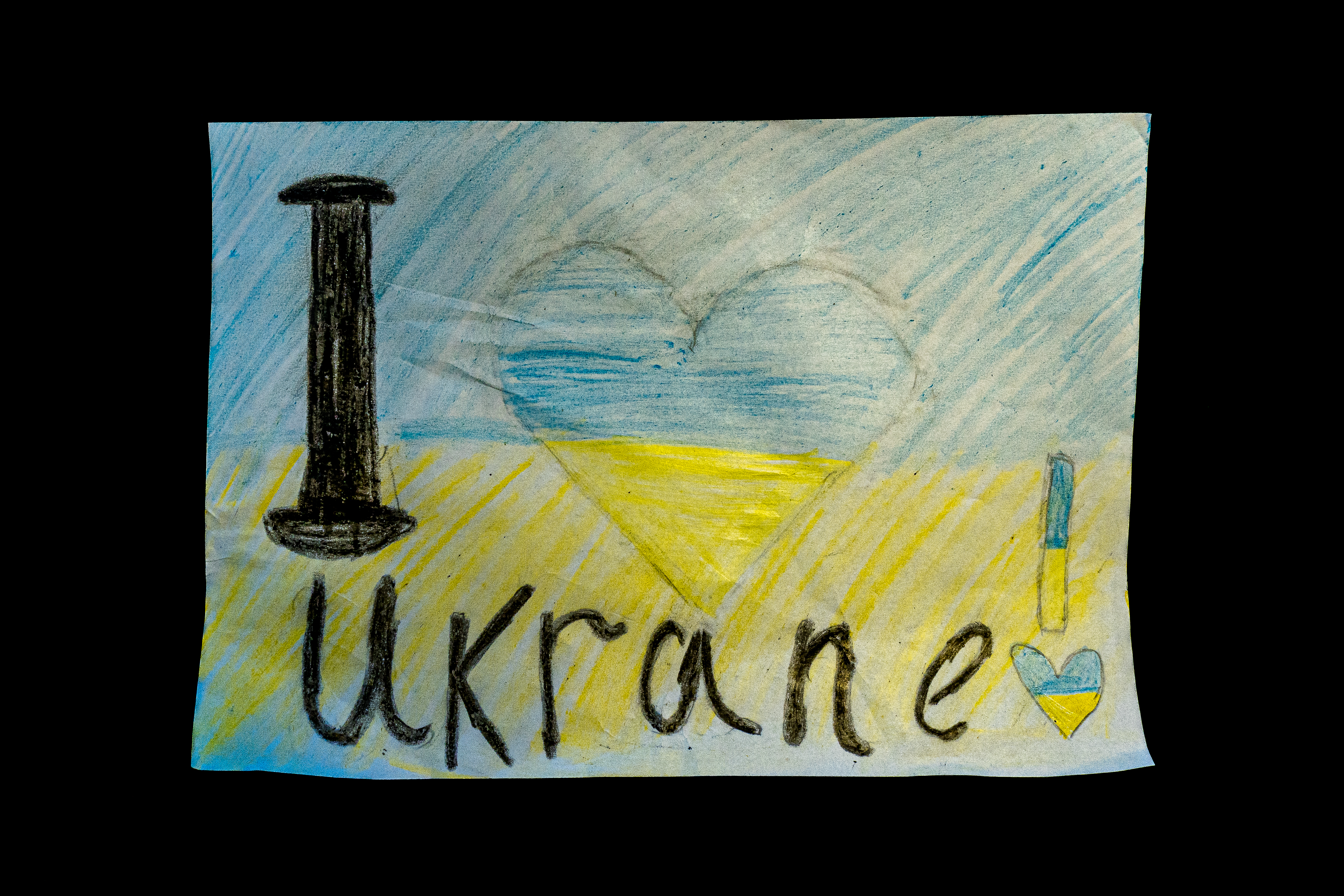 A child's drawing with 'I love Ukraine'