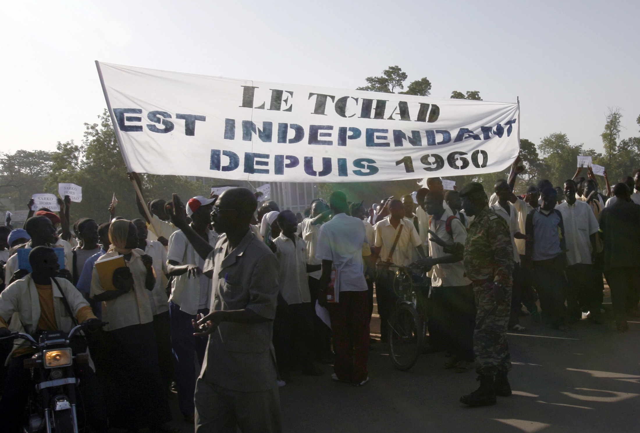 Secondary school students take part in an anti-French demonstration as riot police watch, in the capital N'Djamena November 14, 2007.
