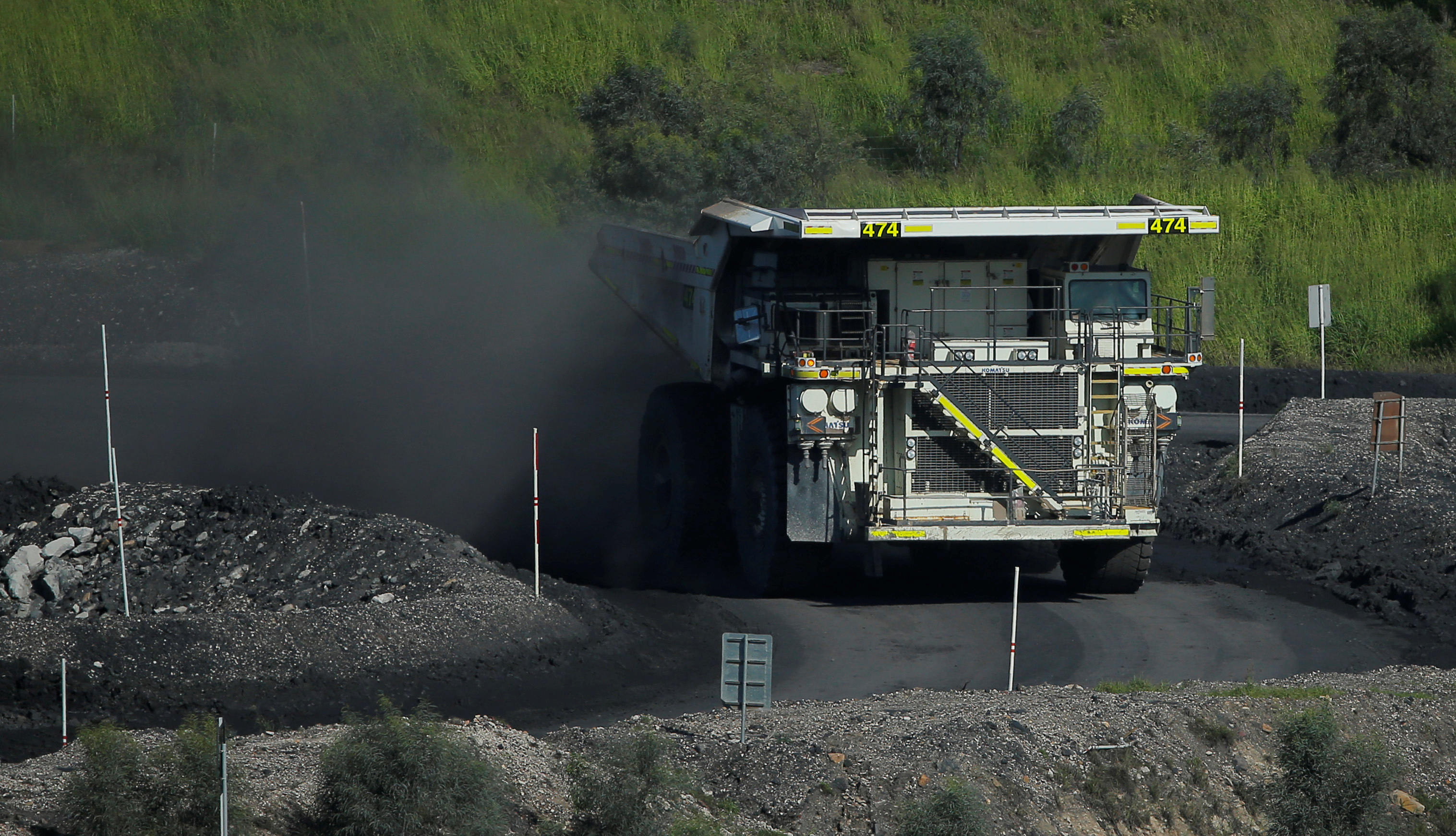 A coal truck drives inside Rio Tinto's Hunter Valley operations in Lemington, NSW sending up clouds of coal dust