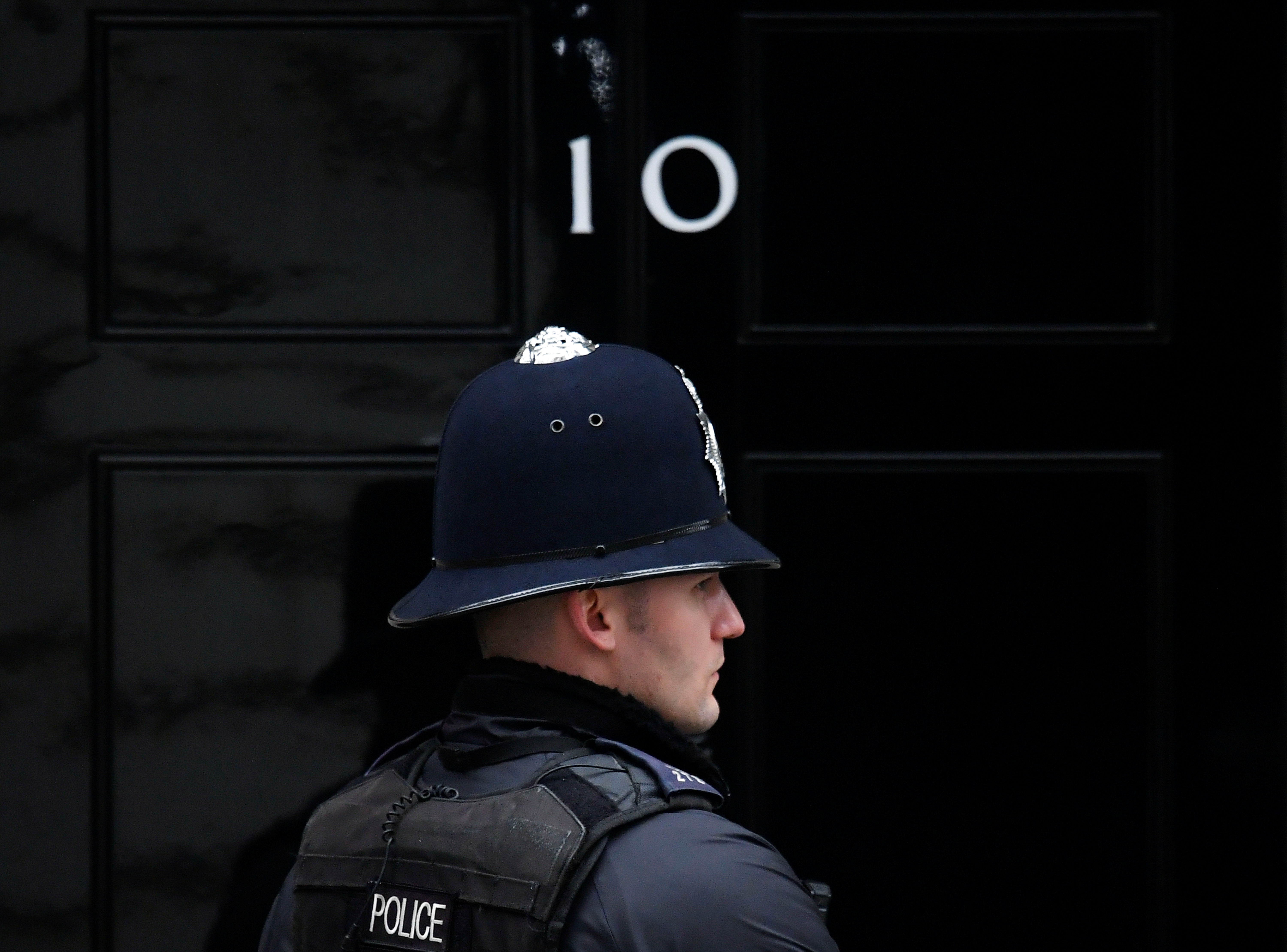 A police officer stands on duty outside 10 Downing Street in London, the UK.