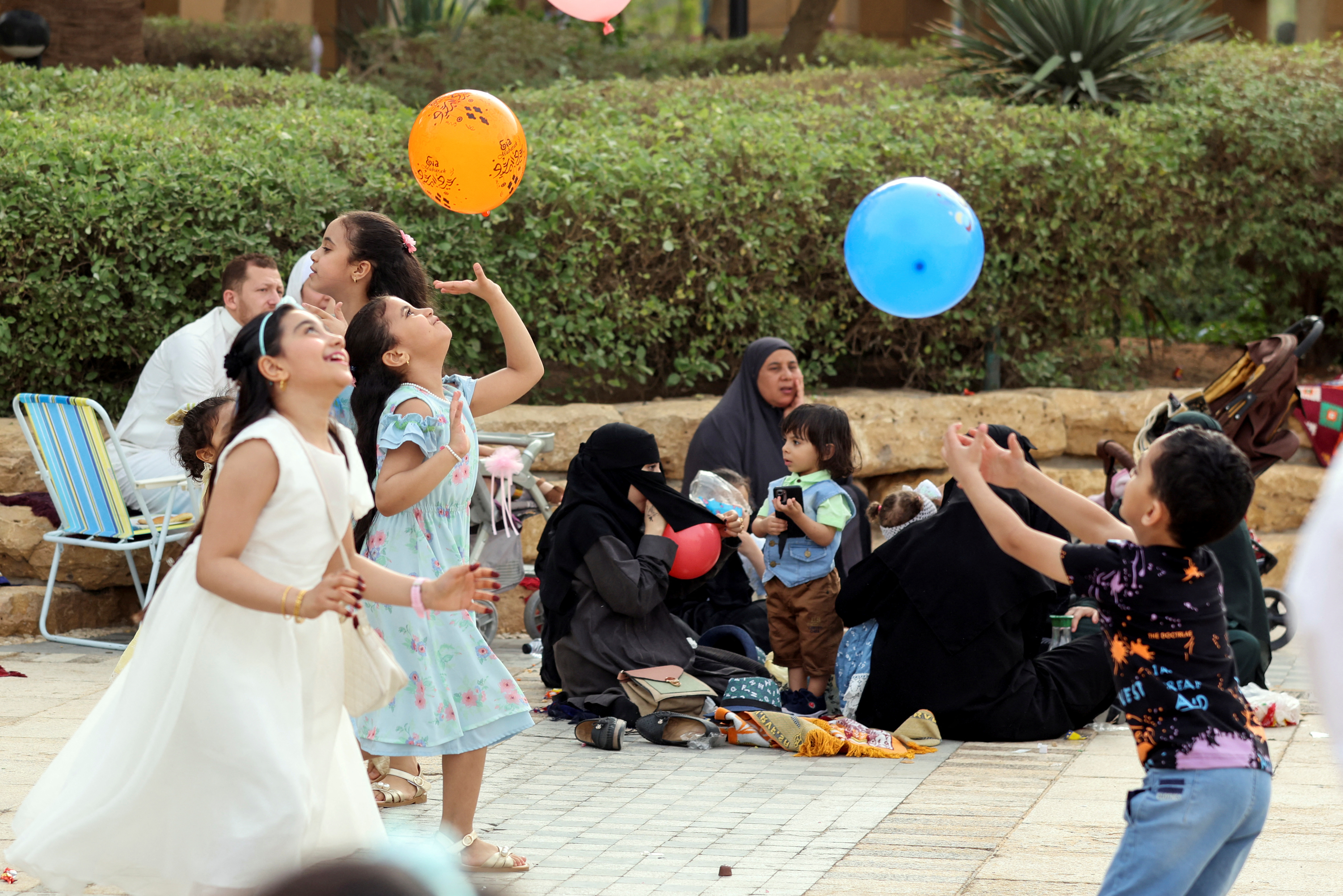 Muslims wait outside the King Abdulaziz Mosque to perform Eid prayers, during Eid al-Fitr in Riyadh, Saudi Arabia