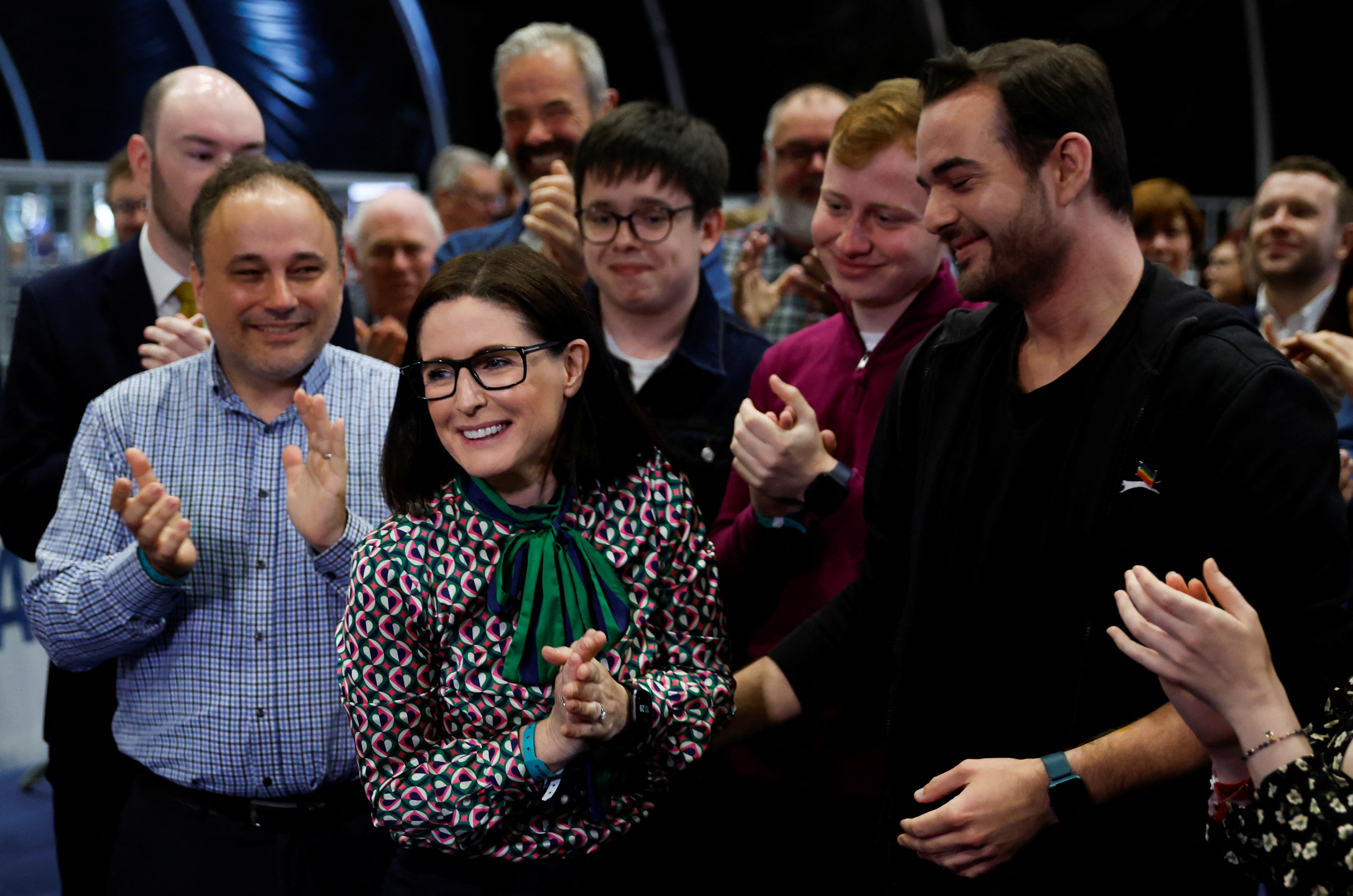 Alliance Belfast South candidate Paula Bradshaw surrounded by applauding crowd