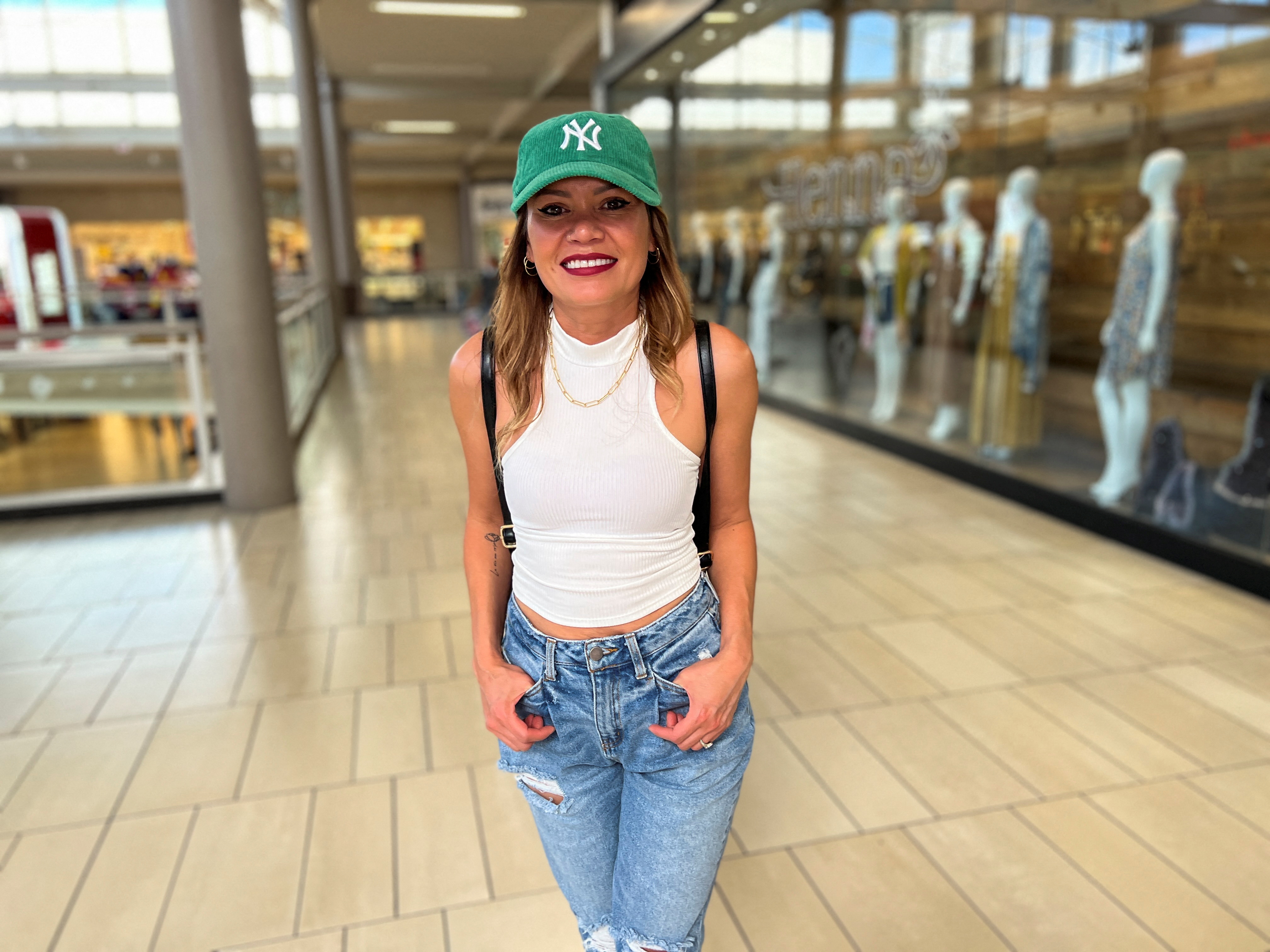 Maria Alvarez poses for a photograph inside a Glendale shopping center after talking to Reuters about her concerns as a voter, in Glendale, Arizona.