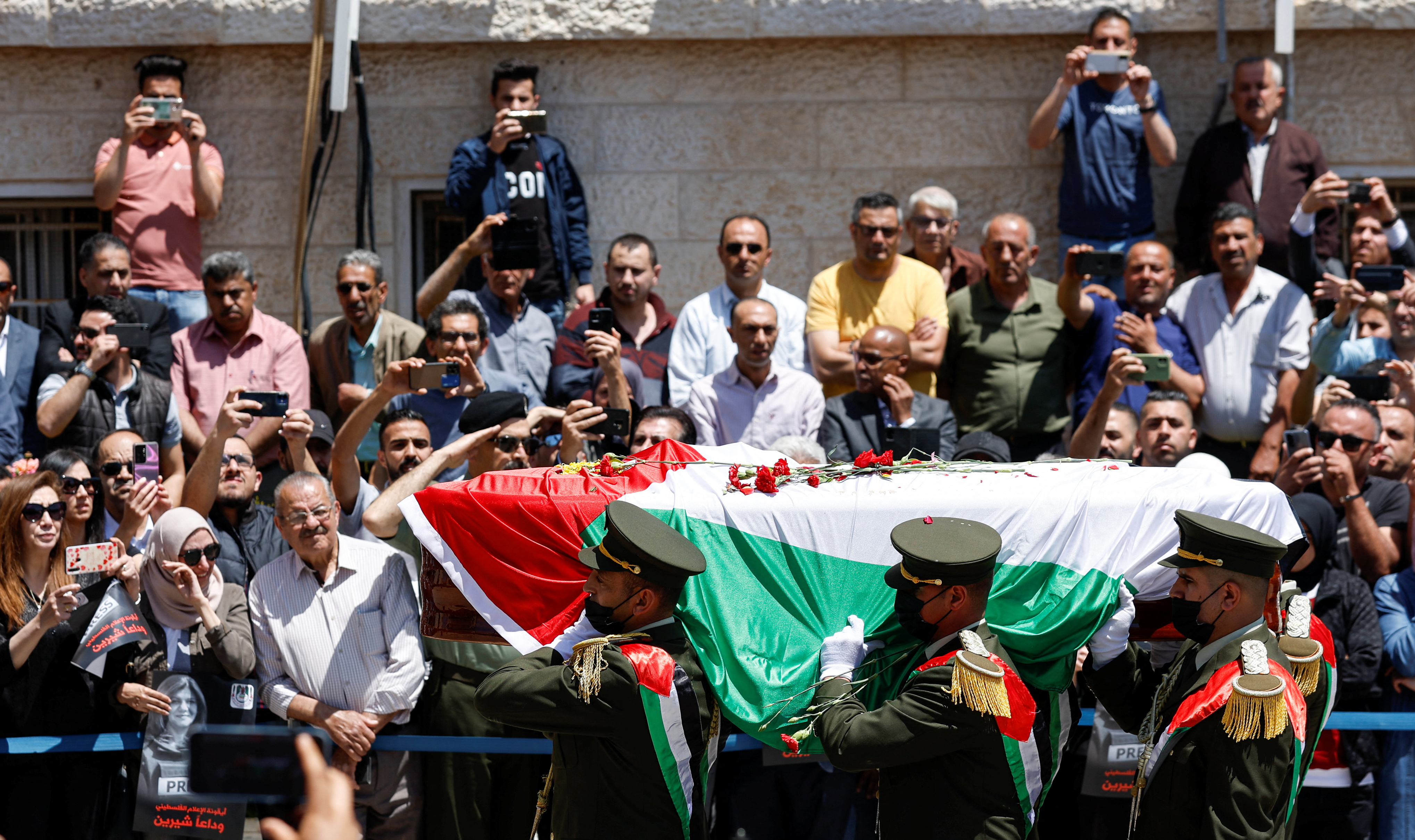 Palestinians attend a state service for veteran Al Jazeera journalist Shireen Abu Akleh.