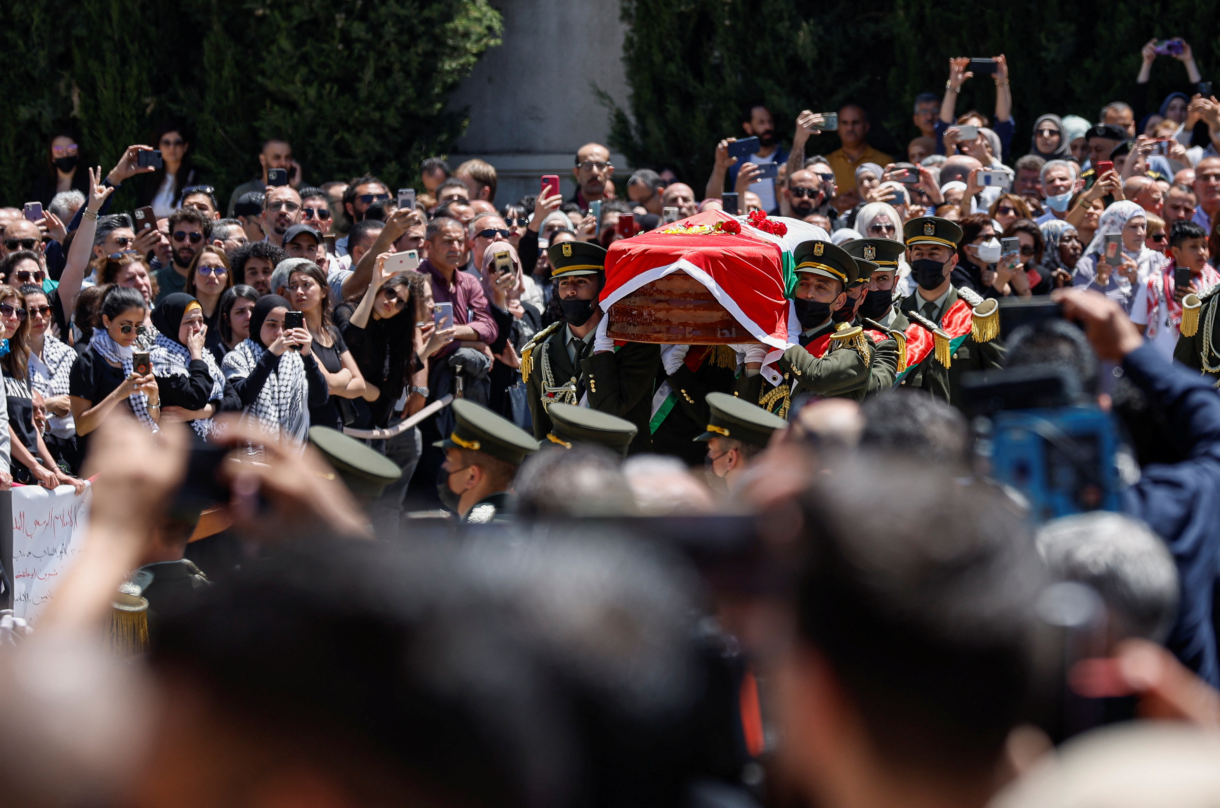Palestinians attend a state service for veteran Al-Jazeera journalist Shireen Abu Akleh