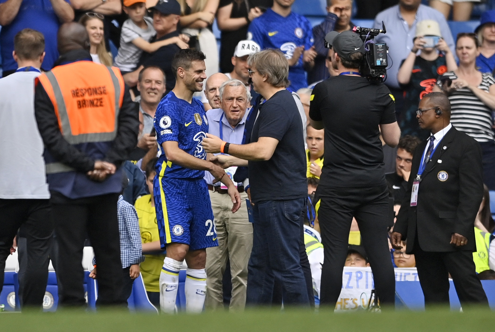 Prospective Chelsea owner Todd Boehly speaks with Chelsea's Cesar Azpilicueta after a match