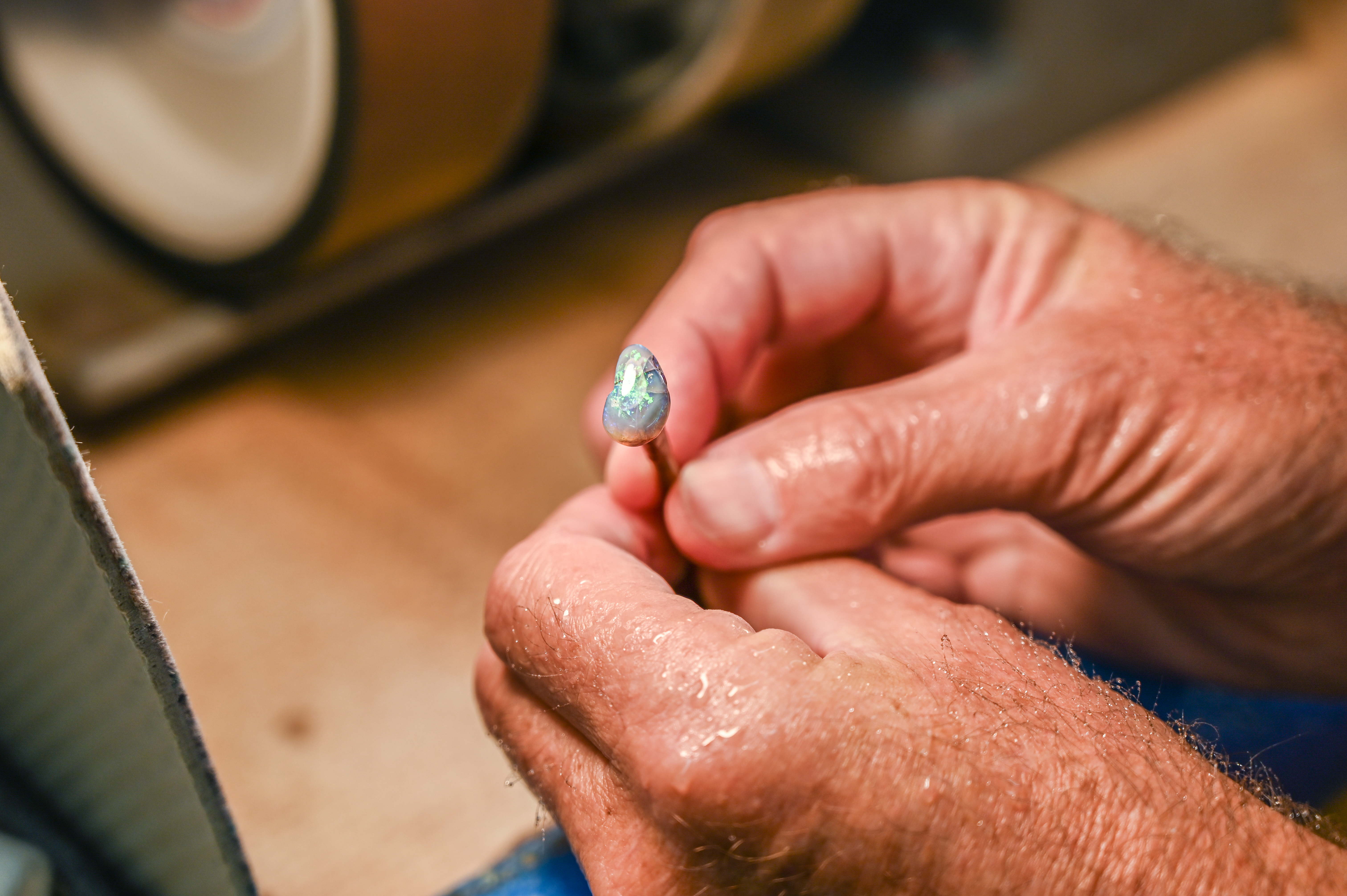 A photo of an opal part-way through the cutting process.