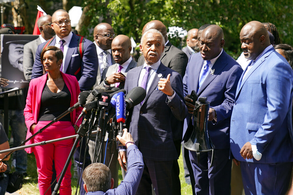 The Rev. Al Sharpton, center, address a news conference with attorneys and George Floyd family members after former Minneapolis police officer Derek Chauvin was sentenced to 22 1/2 years in prison.
