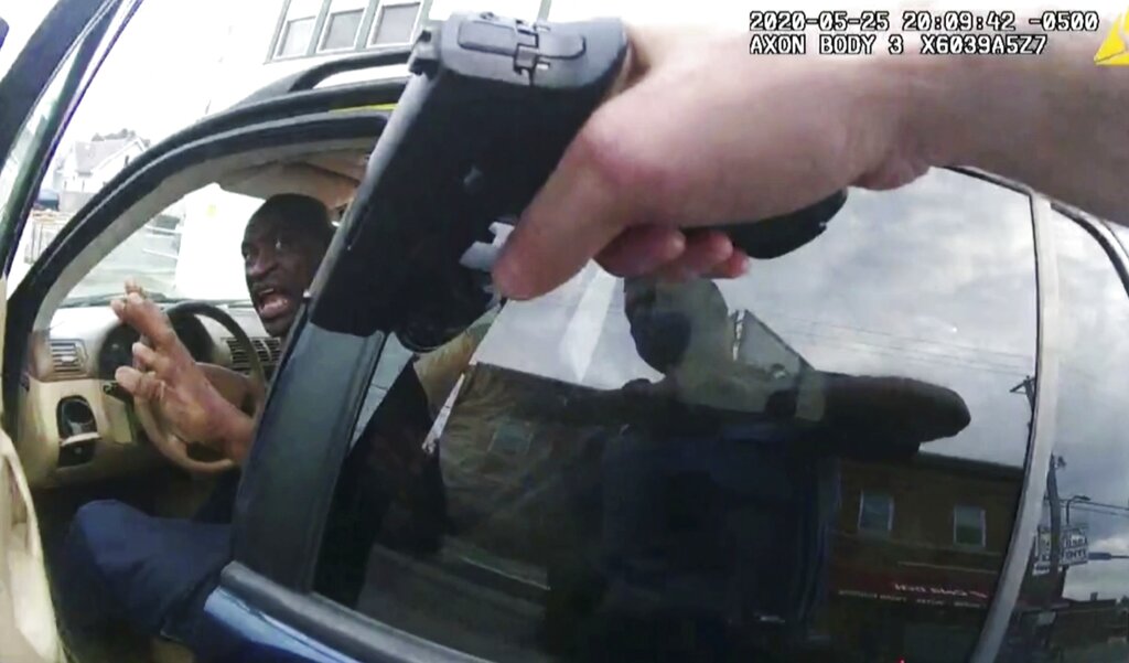 George Floyd responds to police after they approached his car outside Cup Foods in Minneapolis in this May 25, 2020, file pool photo from police body camera video. 