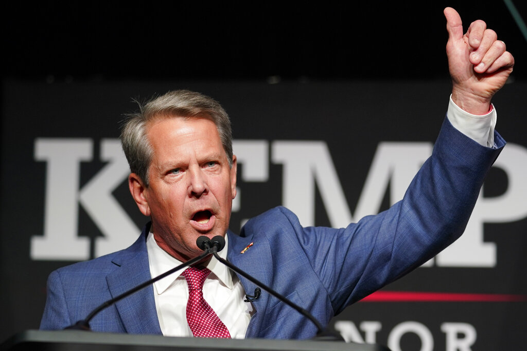 Republican Gov. Brian Kemp waves to supporters during an election night watch party,