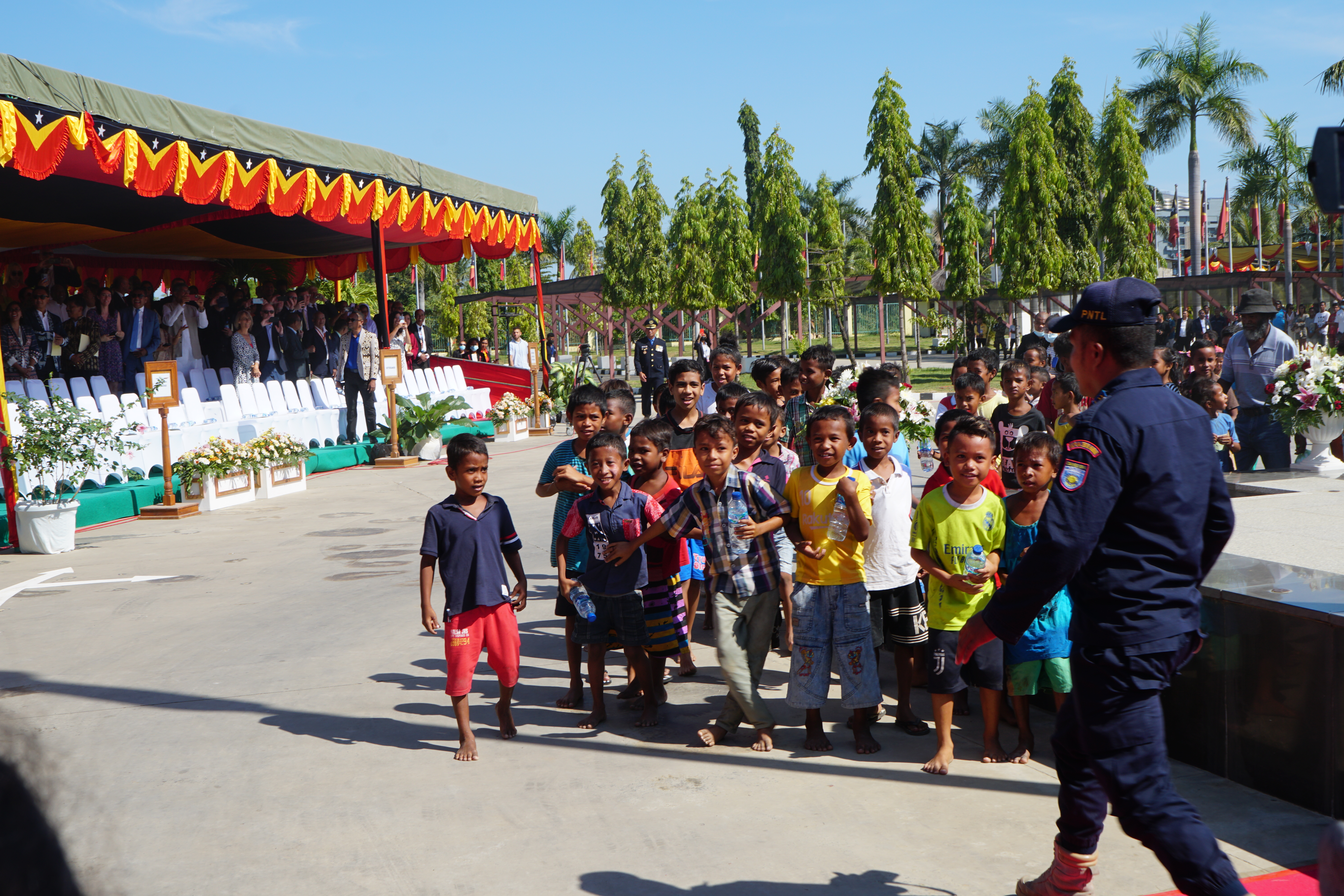 Excited children wait to be allowed up to the stage where president Ramos Horta has been inaugurated in Dili's presidential palace