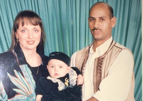 A photo of the author as a toddler with her mother and father