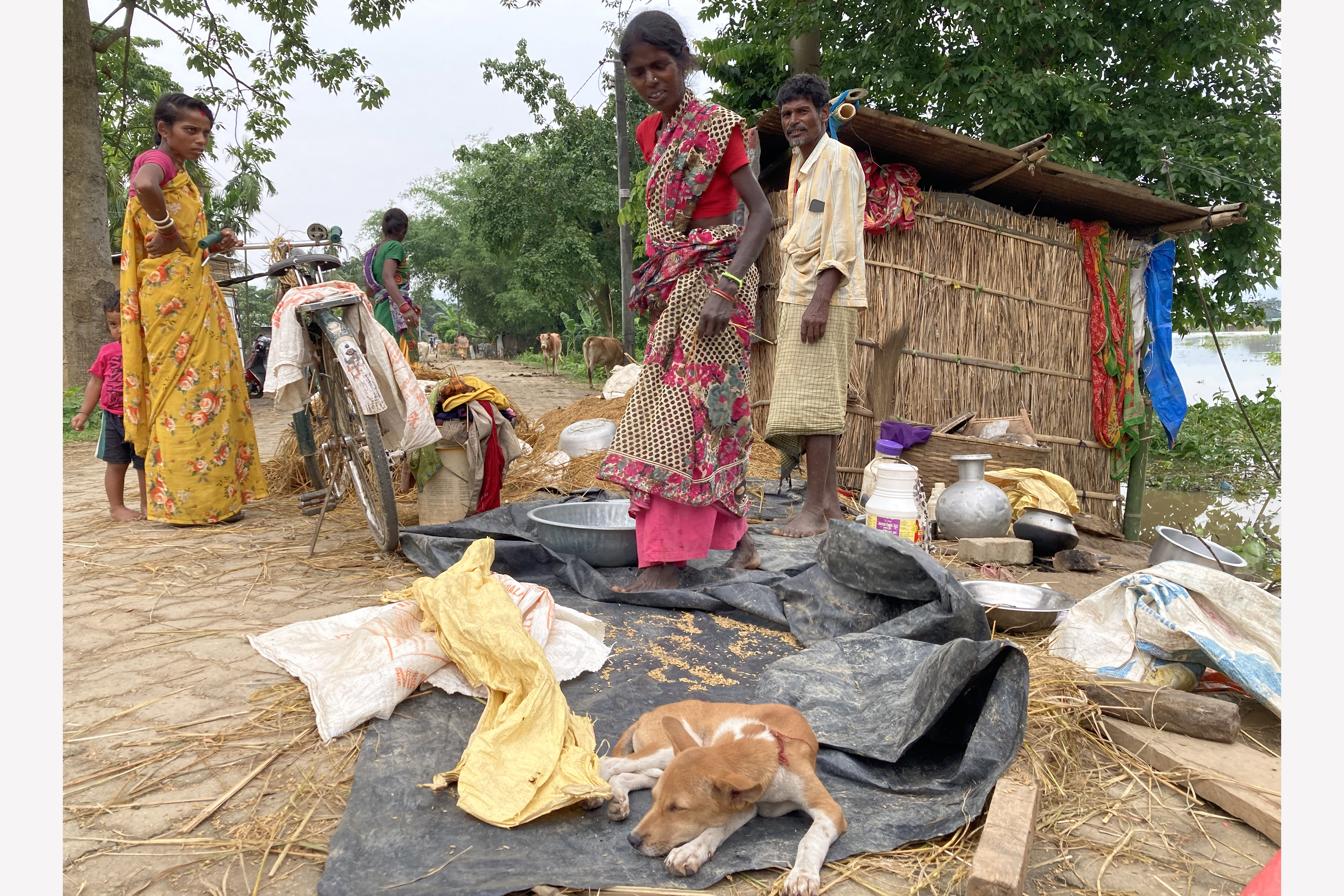 Kushila Rajbhar outside her flooded house