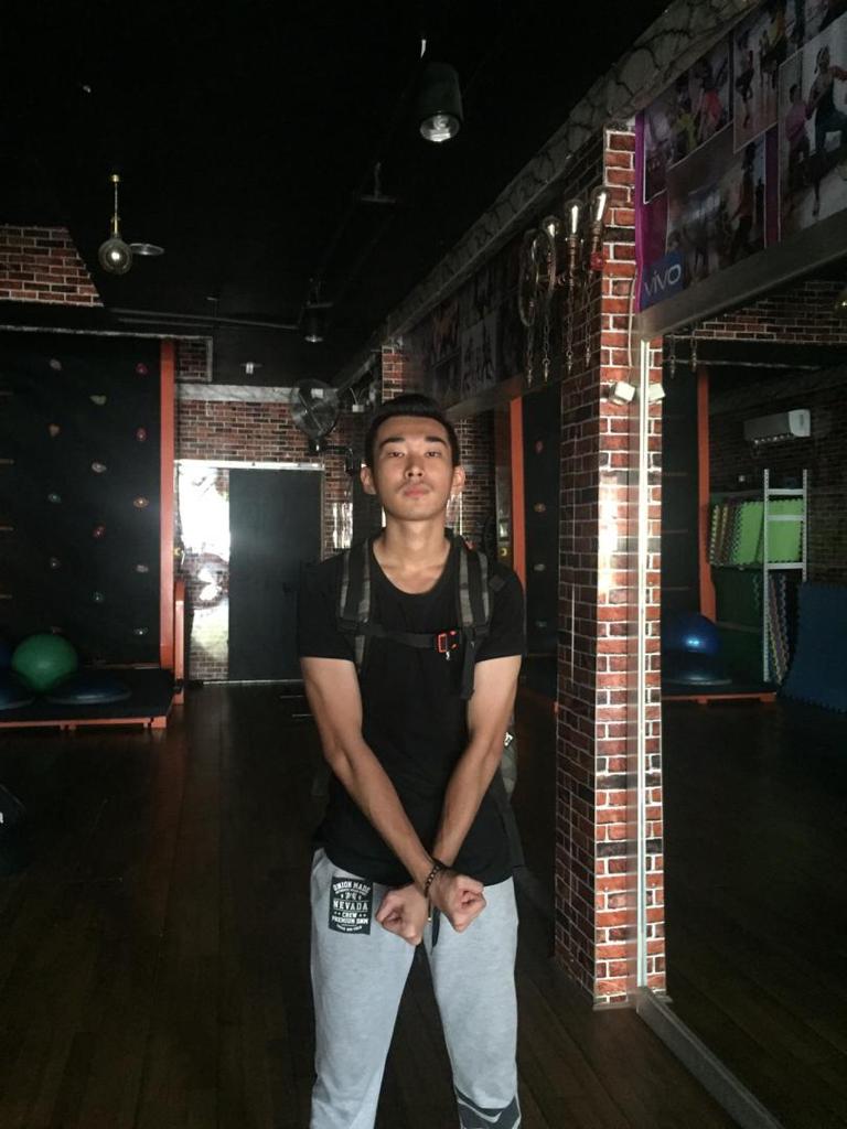 Jerry Liong in black t-shirt and jeans, pictured at night